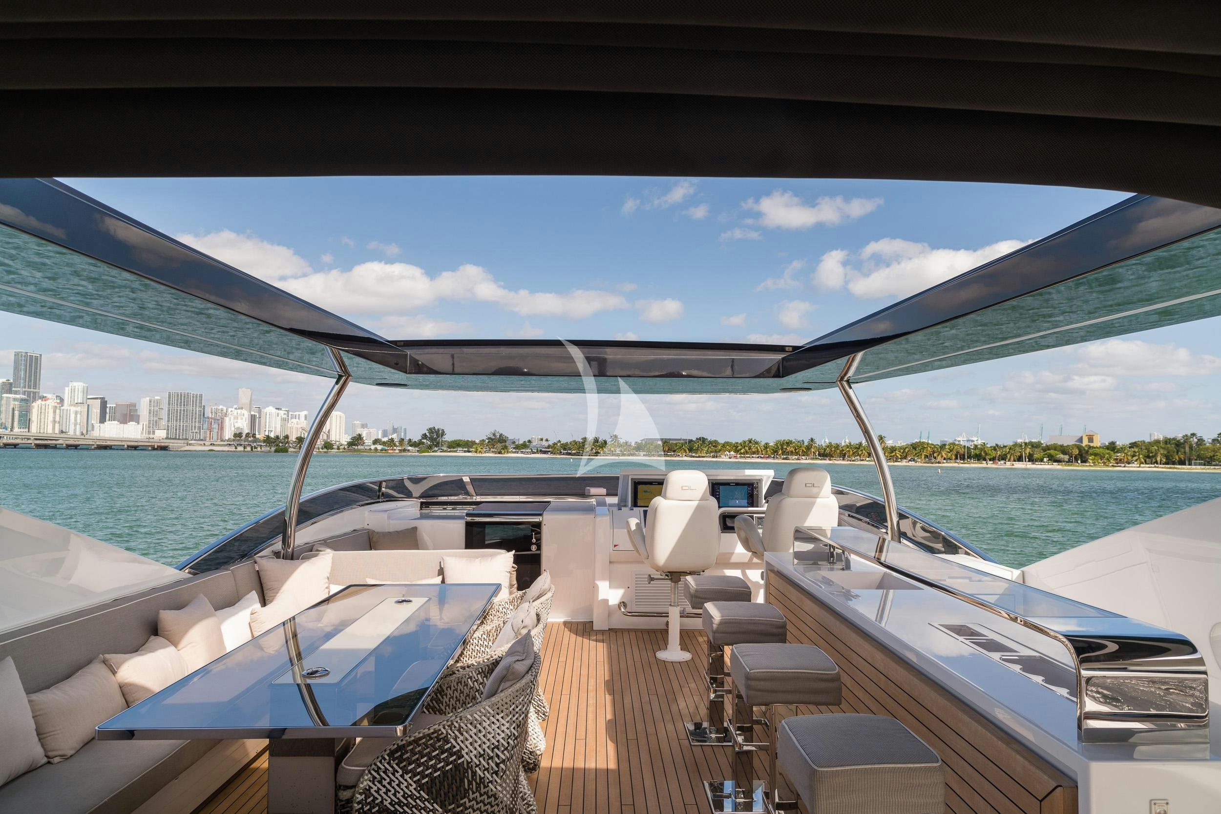a deck with a view of a city and a body of water aboard THE PEDDLER Yacht for Sale