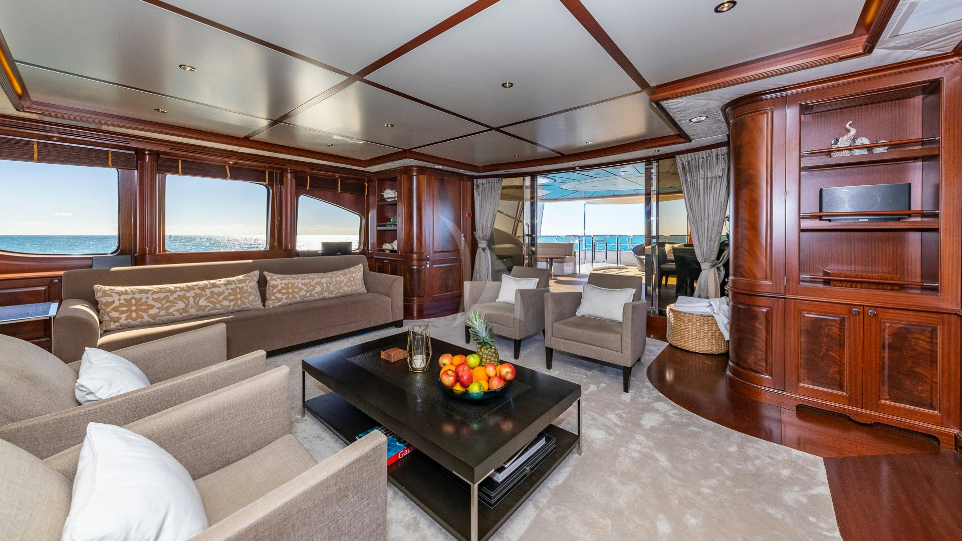 a living room with a couch and a coffee table aboard VIRTUE Yacht for Charter