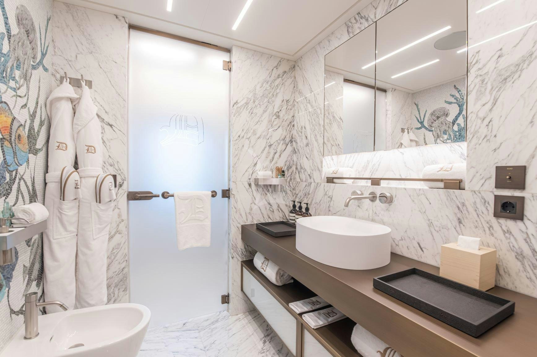 a bathroom with a sink and a mirror aboard LA DATCHA Yacht for Charter