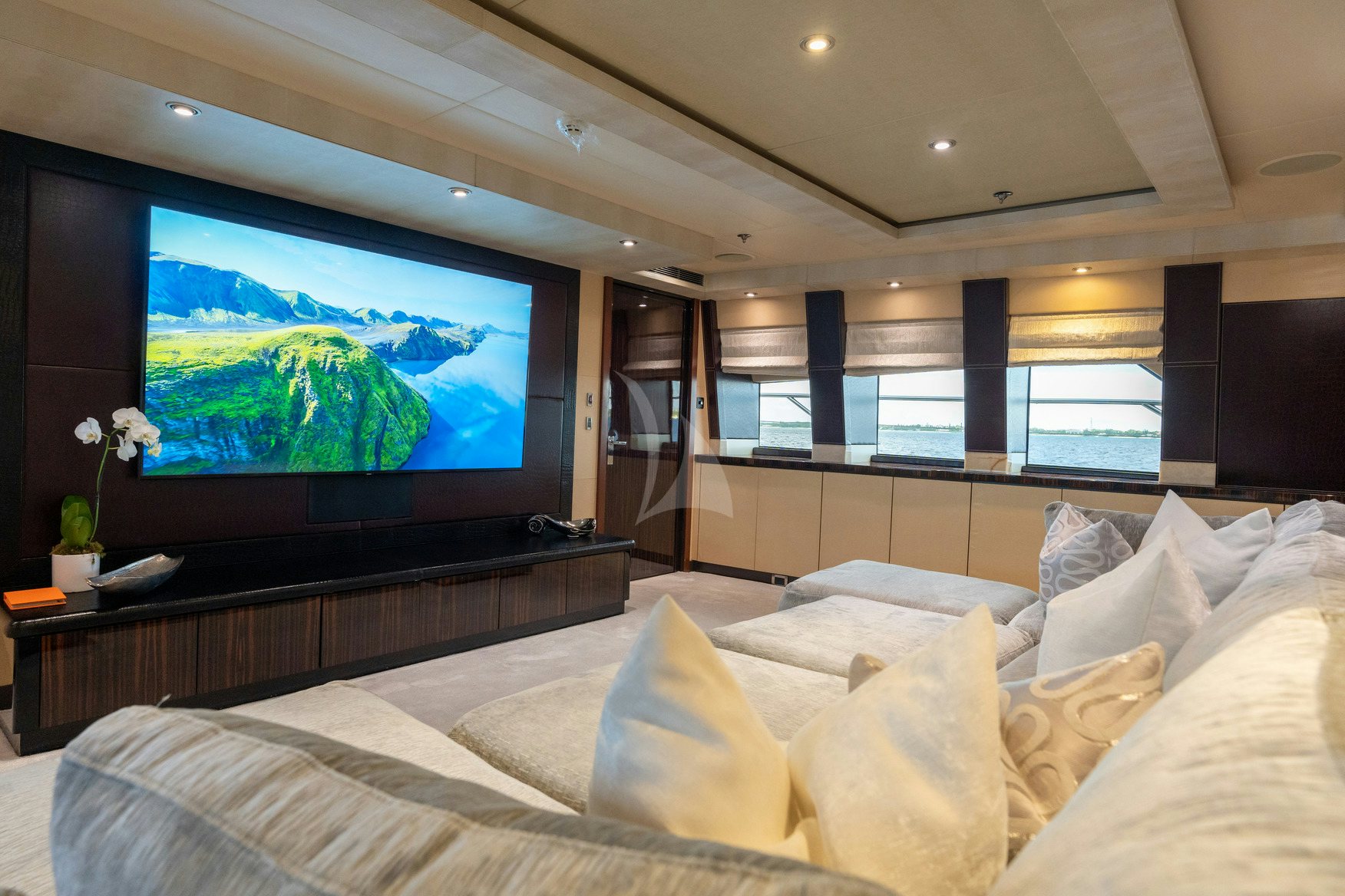 a large television in a room aboard AQUANOVA Yacht for Charter