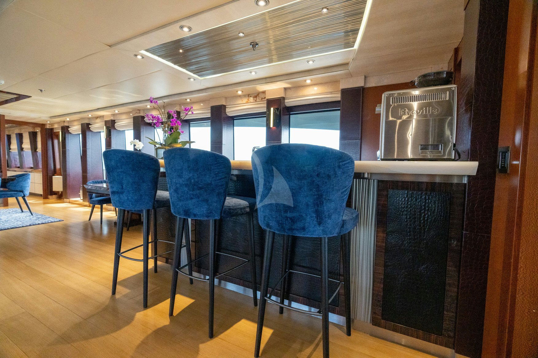 a kitchen with a table and chairs aboard AQUANOVA Yacht for Charter