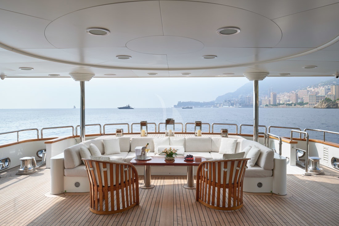 a room with a table and chairs aboard COME PRIMA Yacht for Charter
