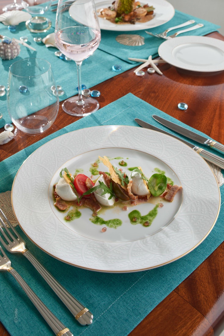 a plate of food on a table aboard COME PRIMA Yacht for Charter