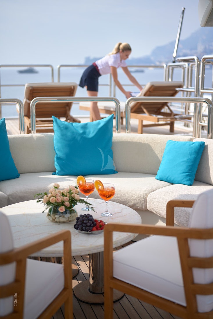 a person standing on a balcony aboard COME PRIMA Yacht for Charter