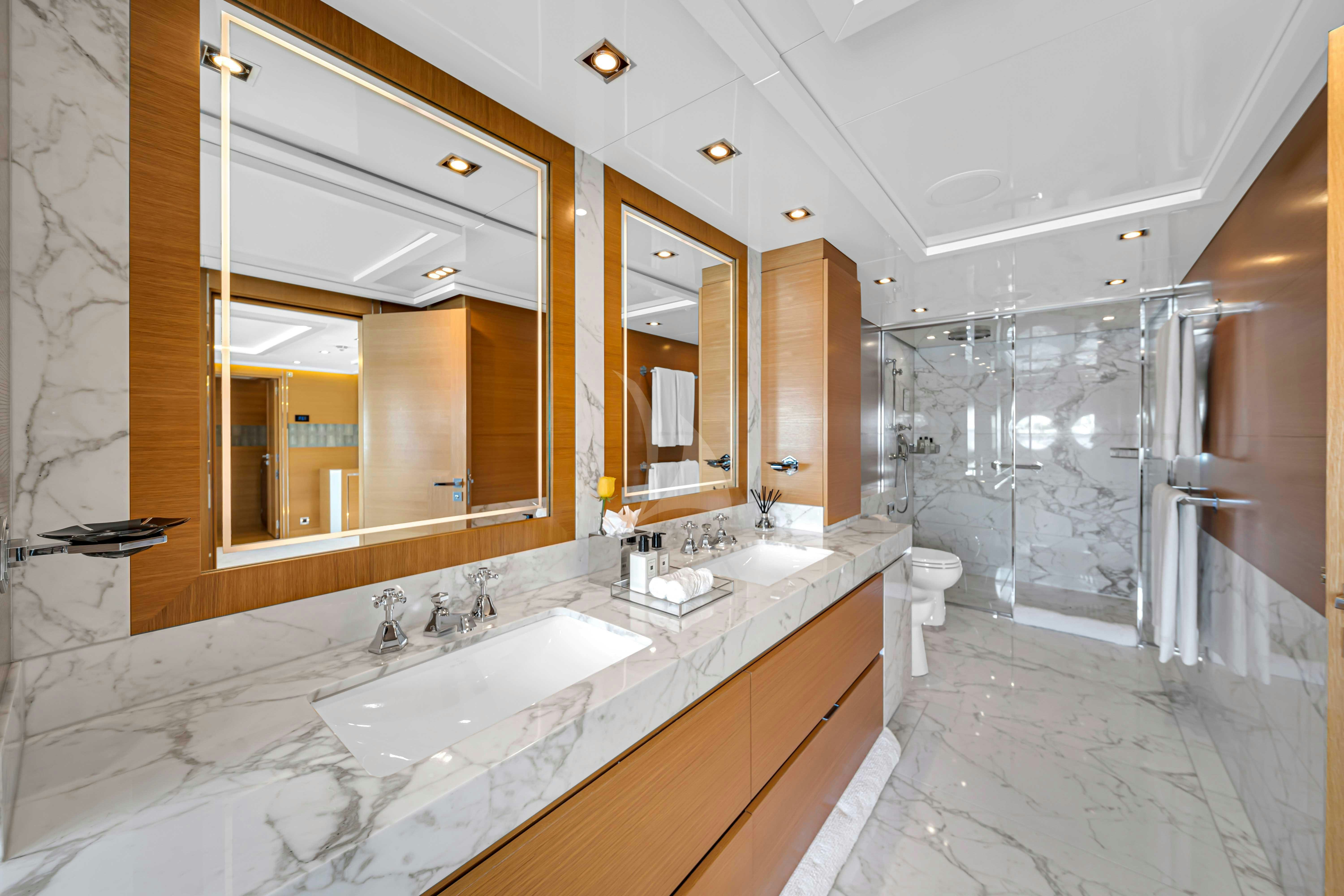 a bathroom with a large mirror aboard DB9 Yacht for Charter