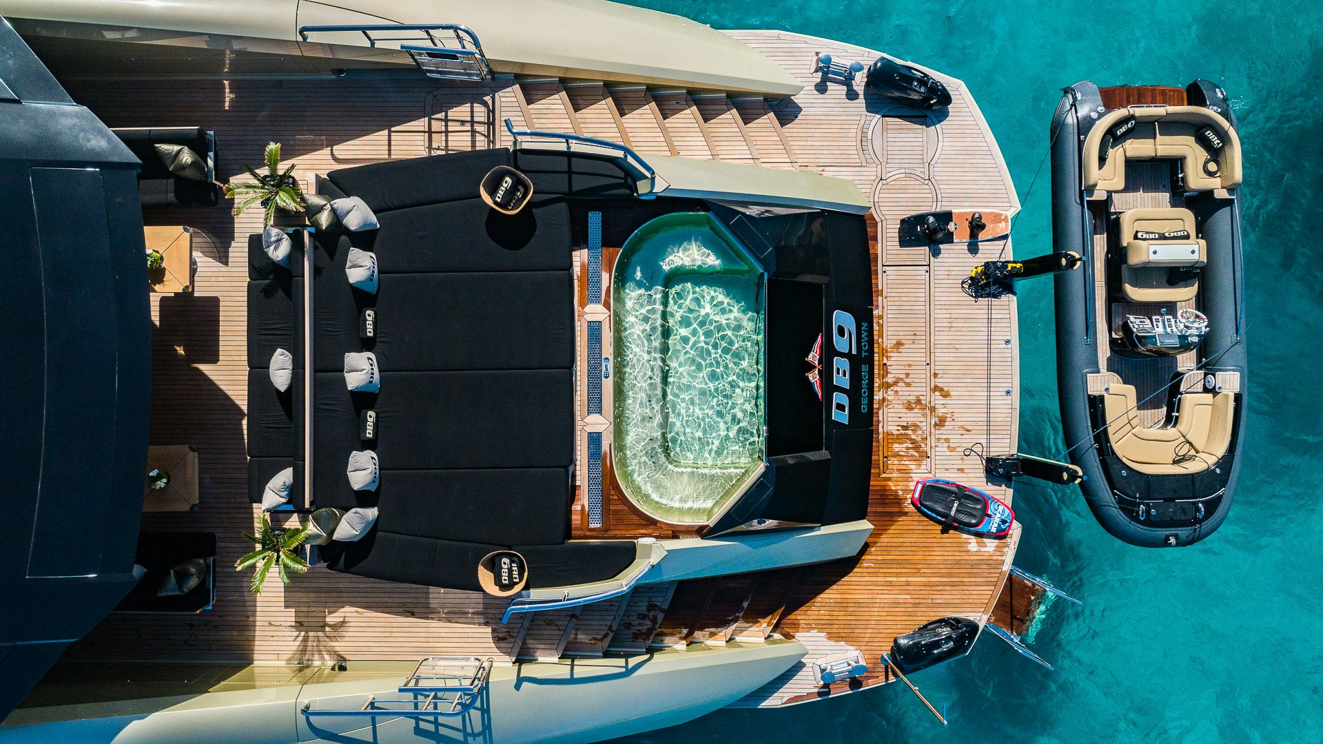 a large black and silver vehicle aboard DB9 Yacht for Charter