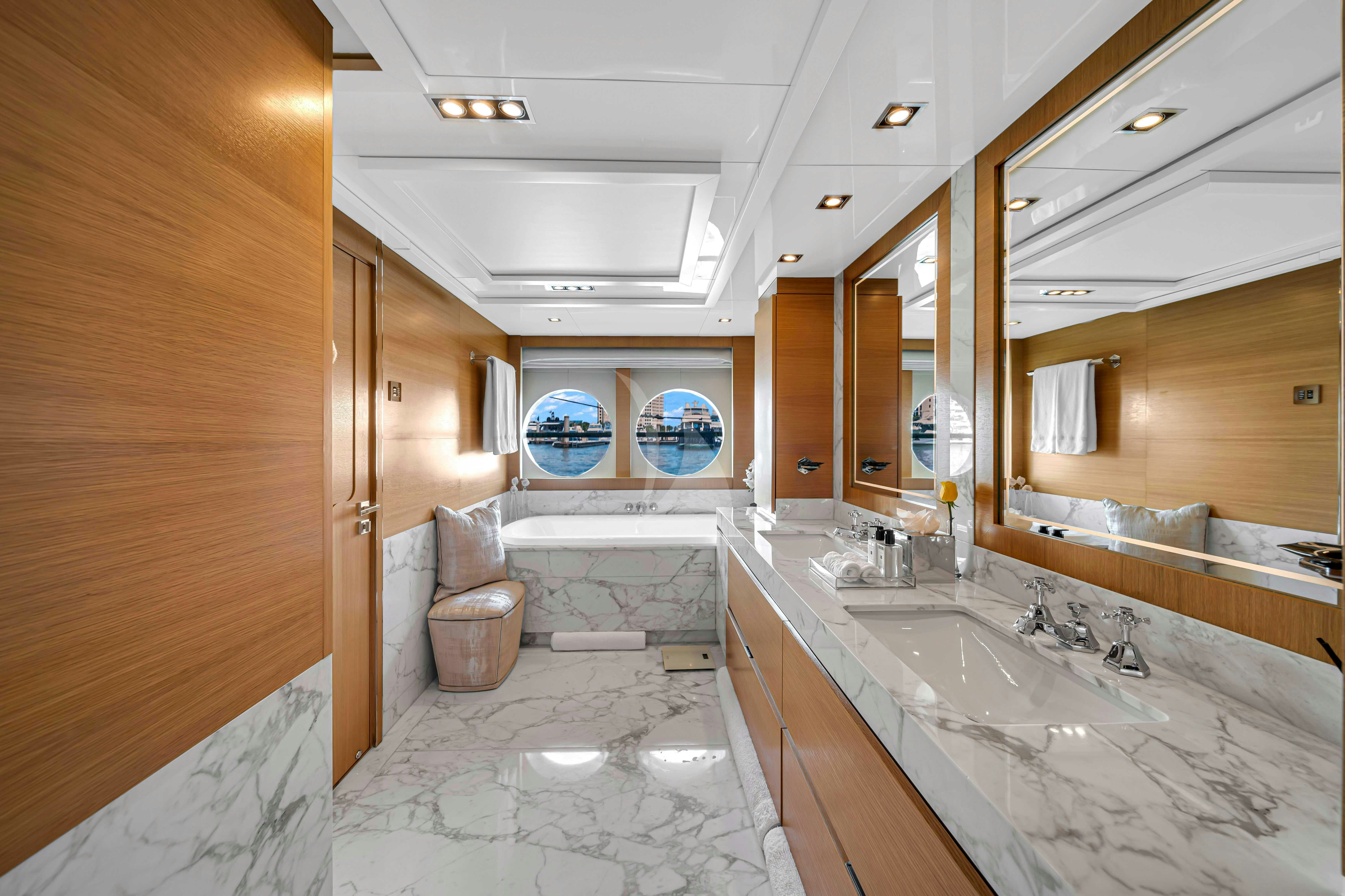 a bathroom with a large bathtub aboard DB9 Yacht for Charter