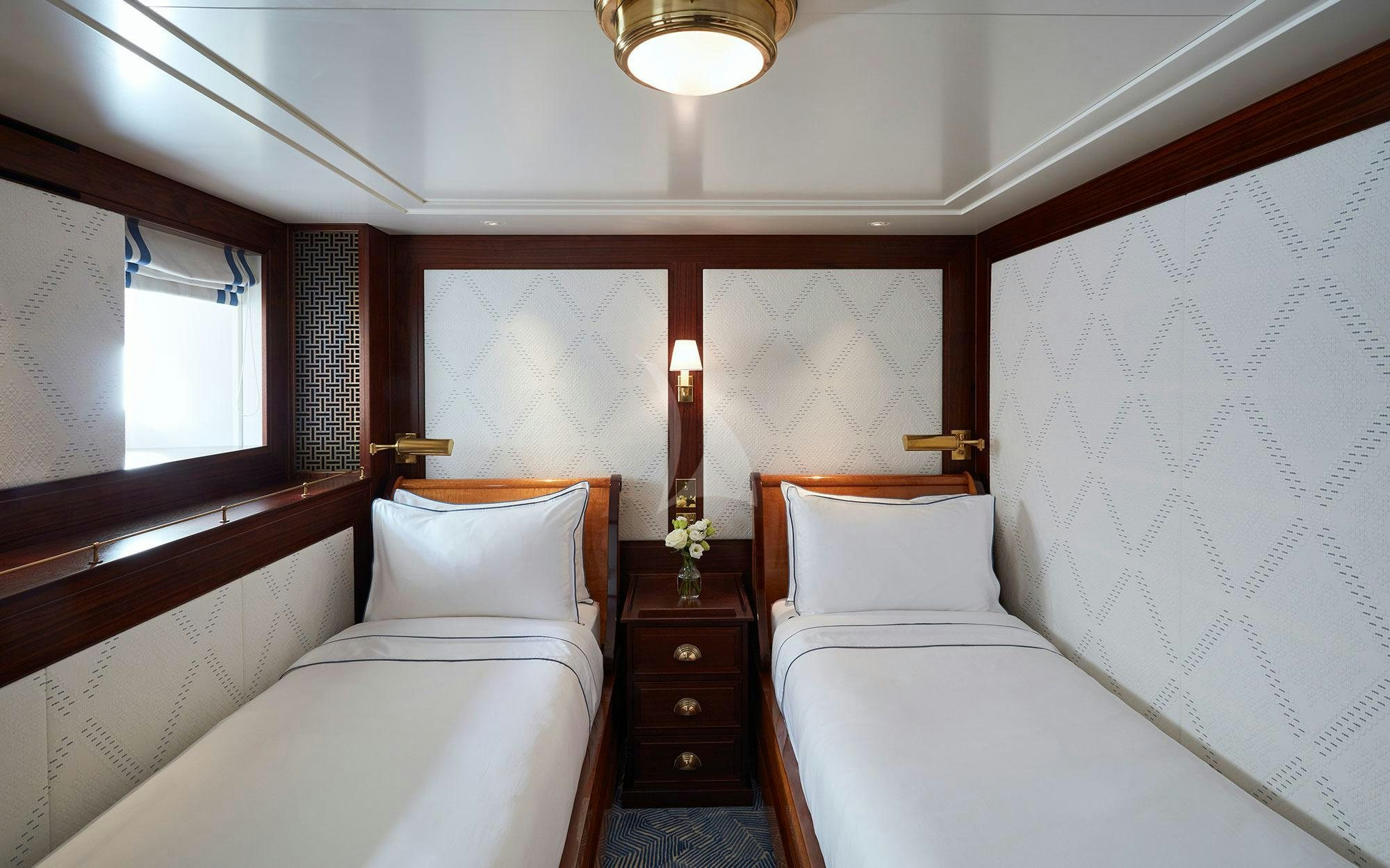 a room with two beds aboard MARALA Yacht for Charter