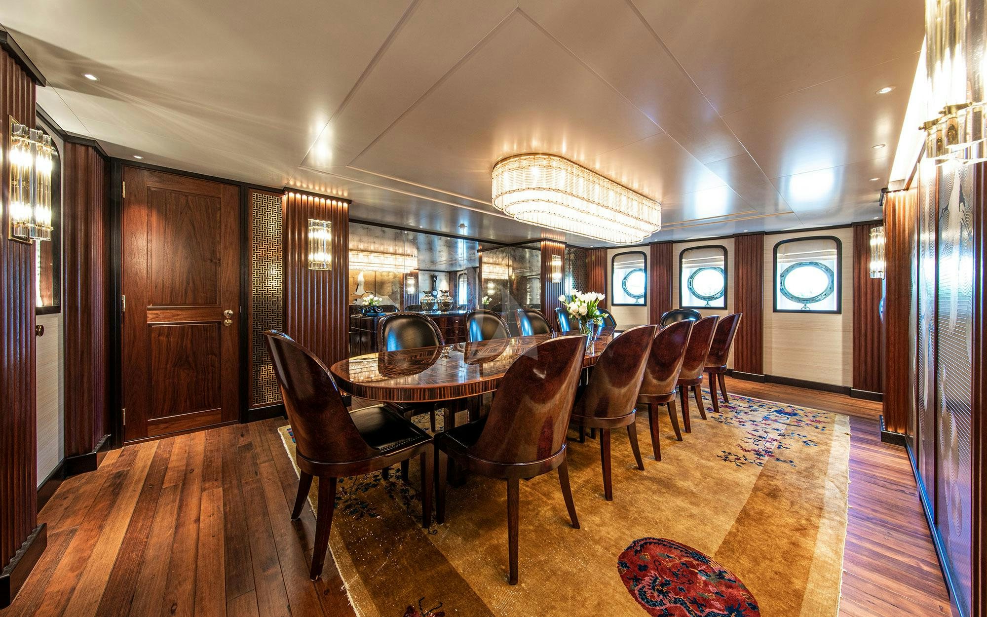 a dining room with a table and chairs aboard MARALA Yacht for Charter