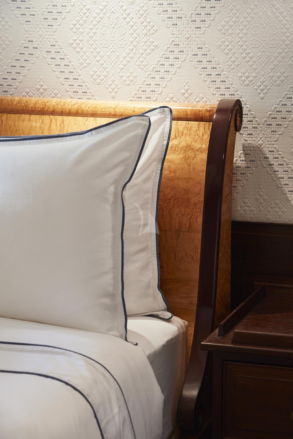 a bed with a pillow aboard MARALA Yacht for Charter