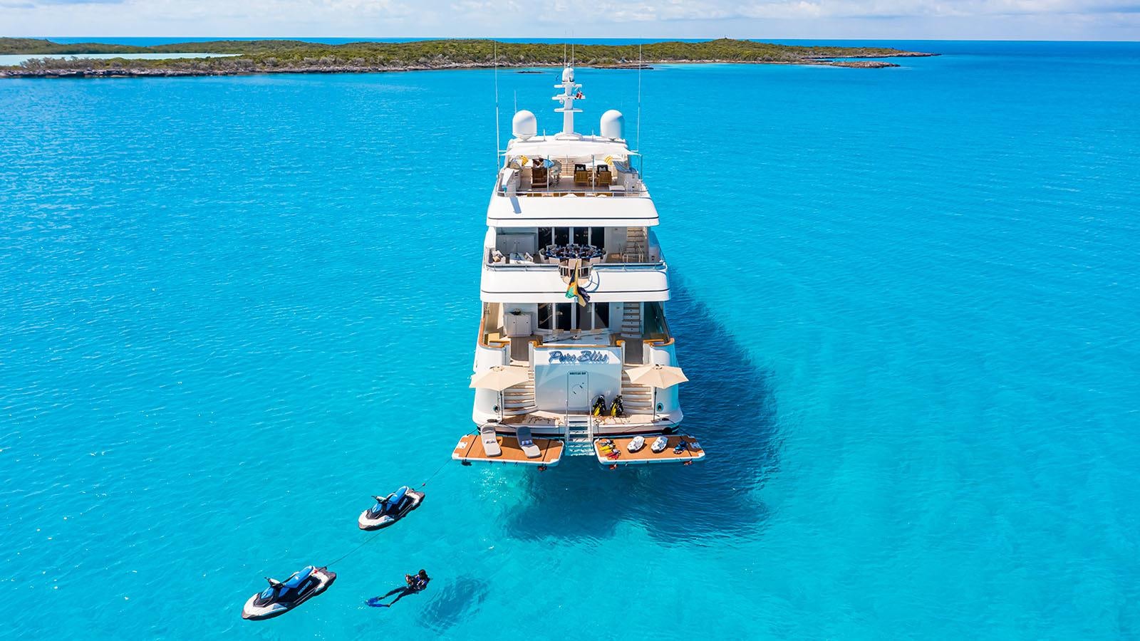 a large white ship in the water aboard CROSSED SABRE Yacht for Charter