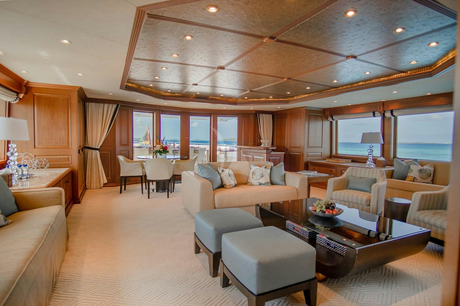 a living room with a large window aboard CROSSED SABRE Yacht for Charter
