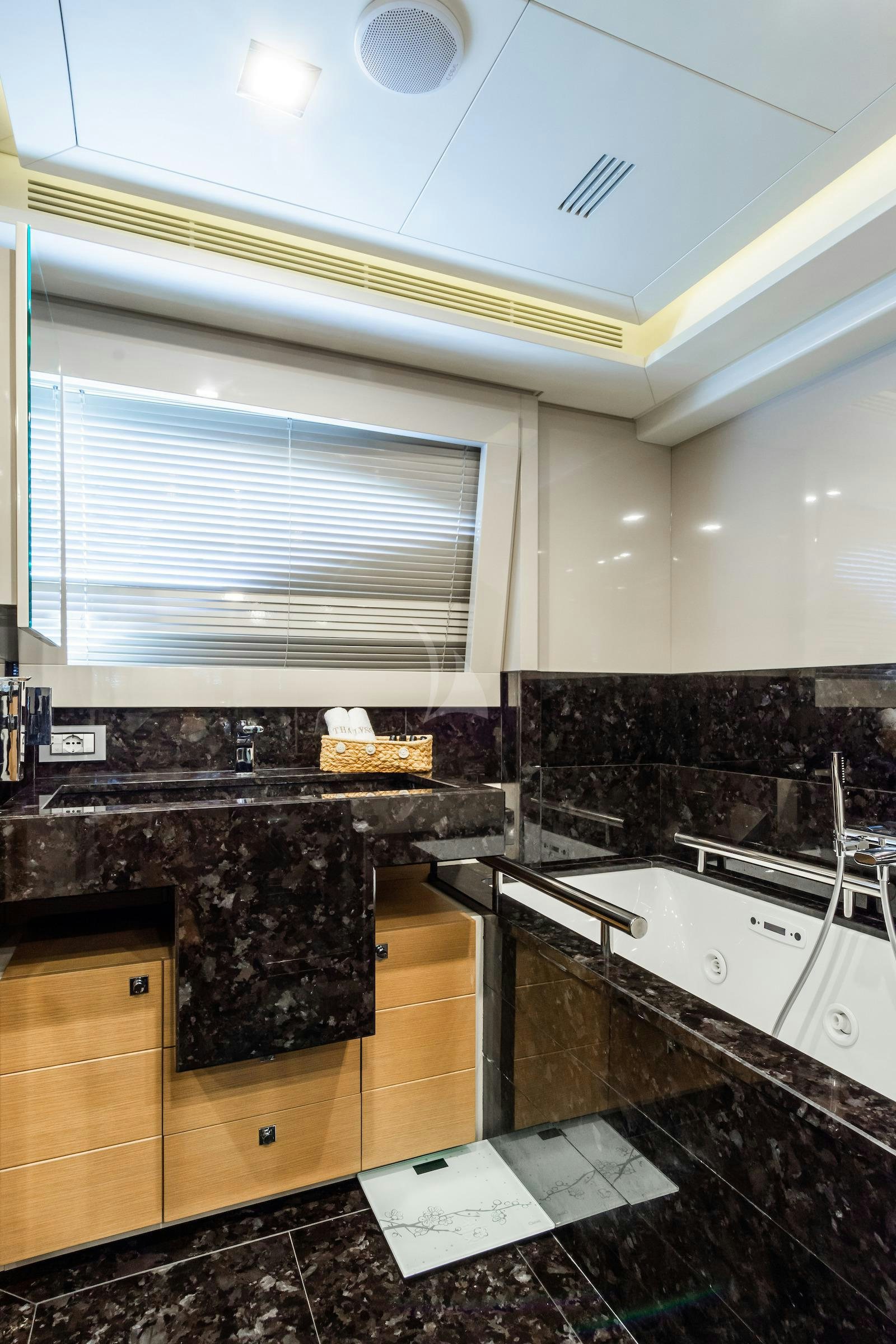 a bathroom with a marble counter top aboard THALYSSA Yacht for Charter