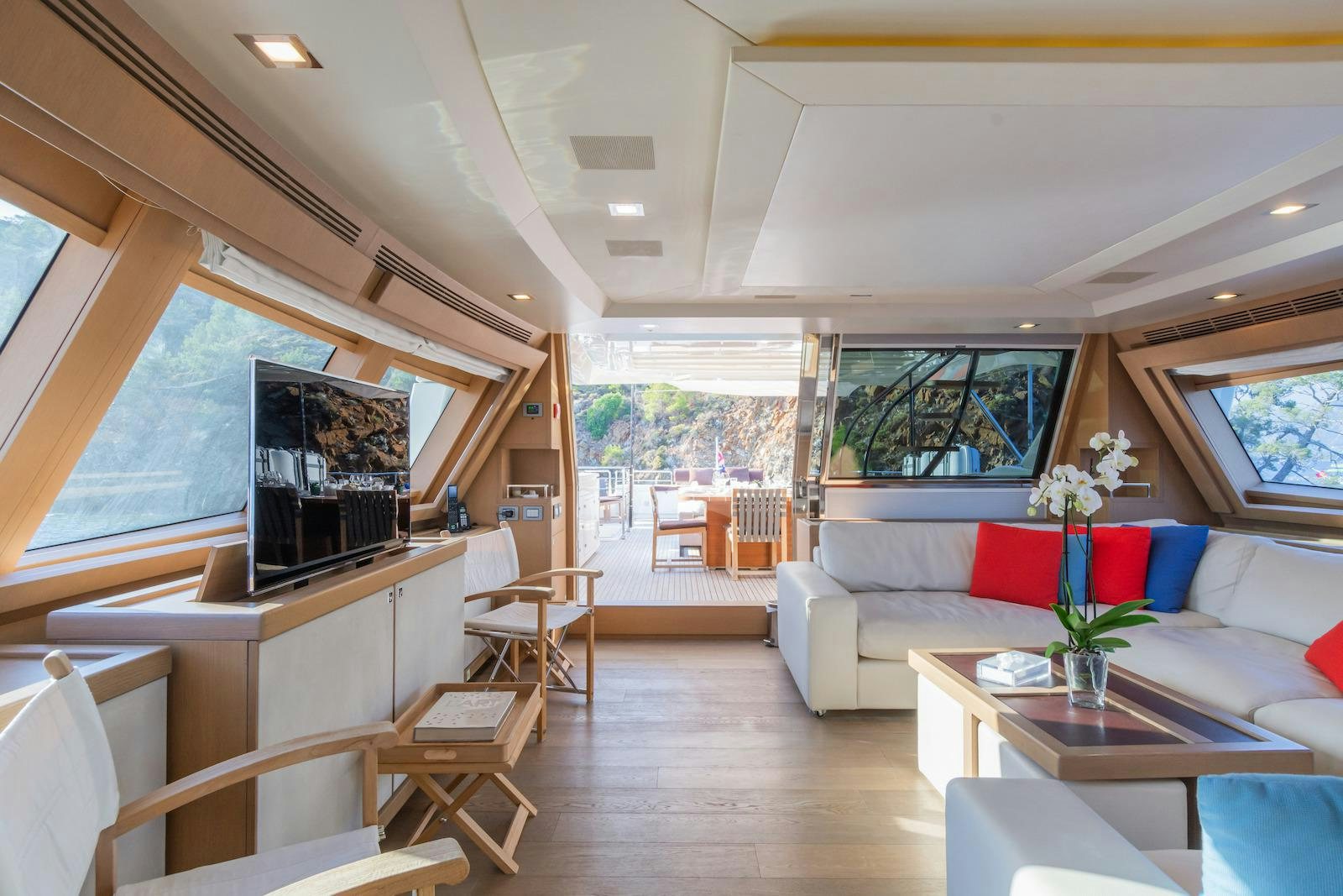 a living room with a couch and a television aboard THALYSSA Yacht for Charter