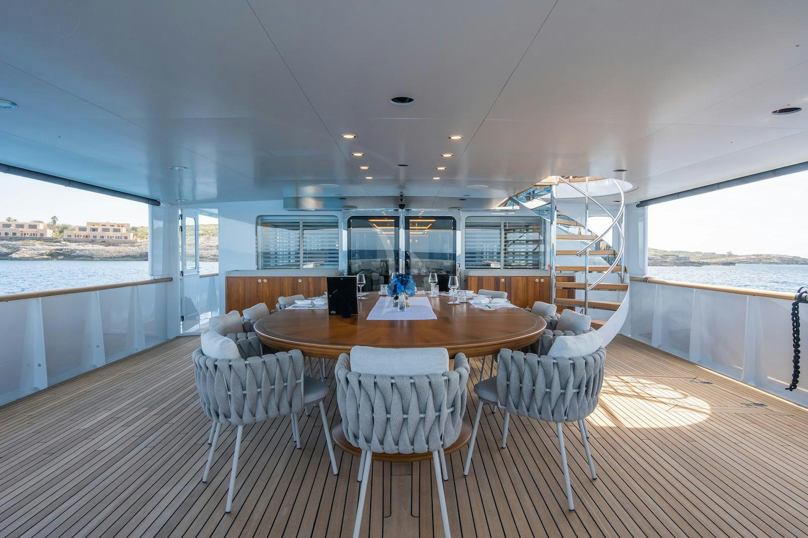 a large dining table in a room aboard EMERALD Yacht for Charter