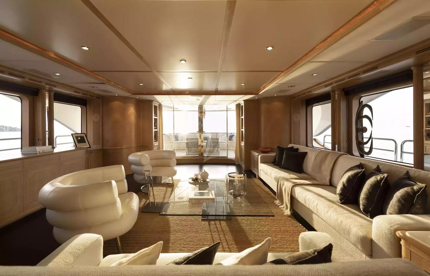 a living room with a large window aboard SOHO Yacht for Charter