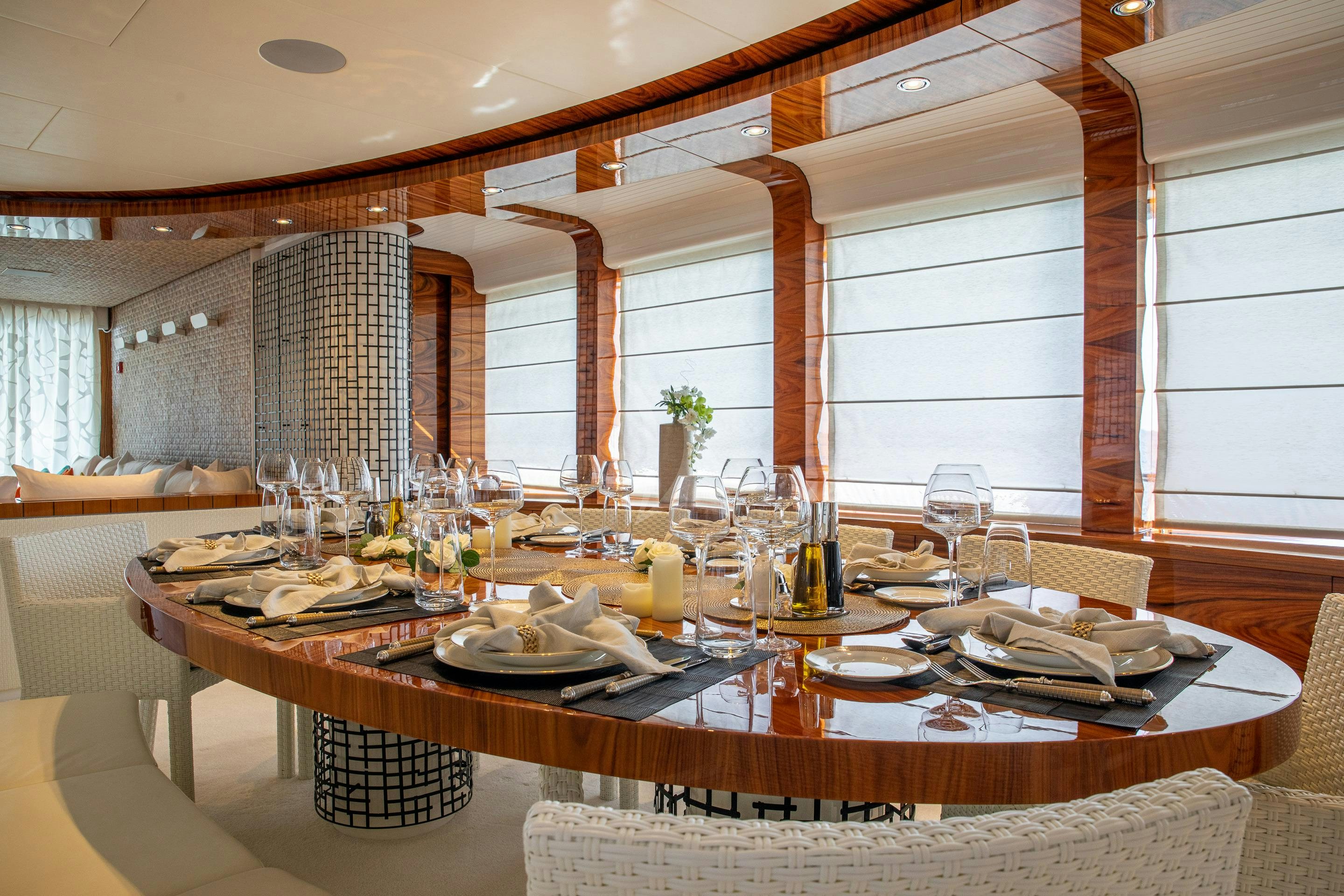 a table with plates and glasses aboard HATT MILL Yacht for Charter