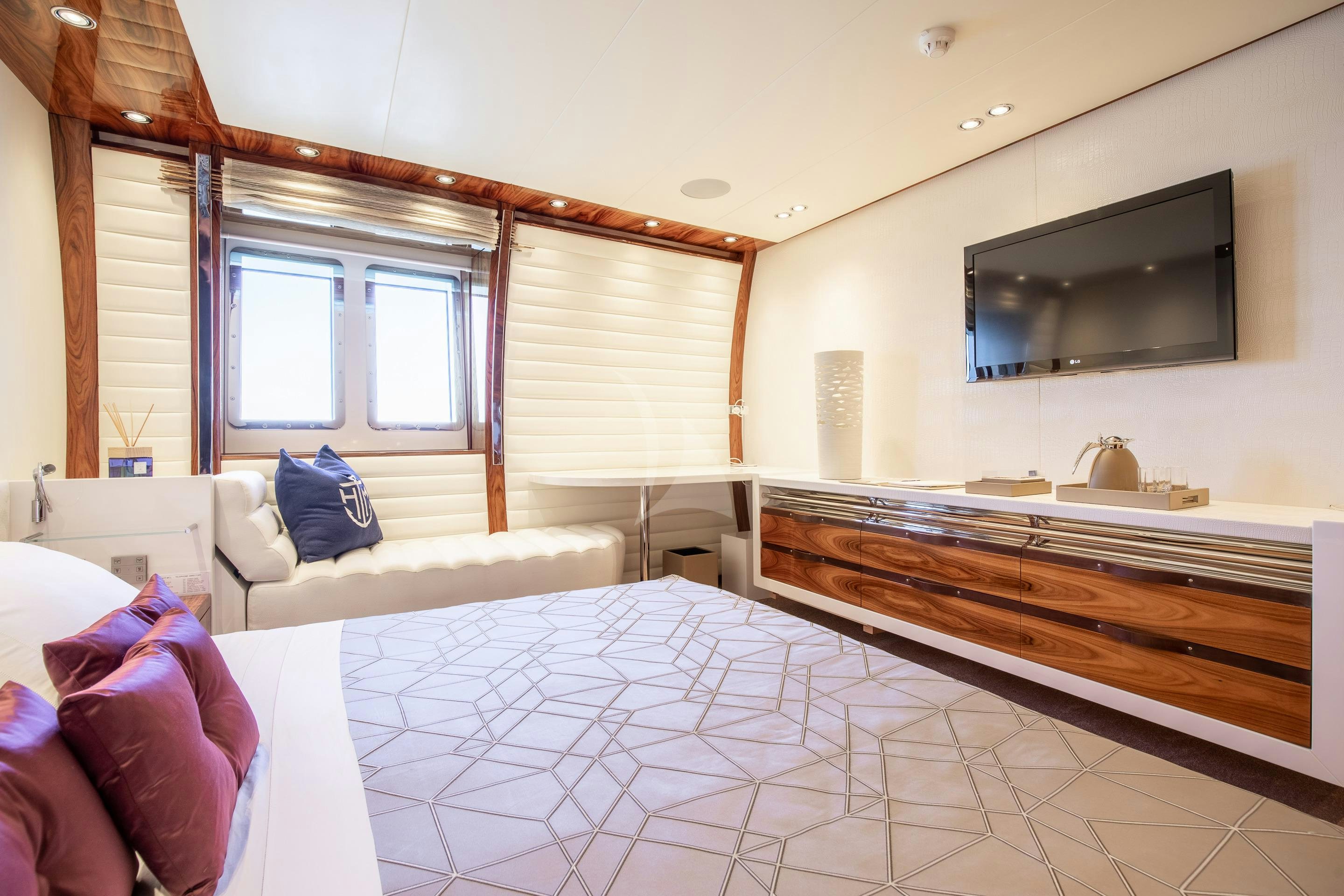 a large bedroom with a large bed aboard HATT MILL Yacht for Charter