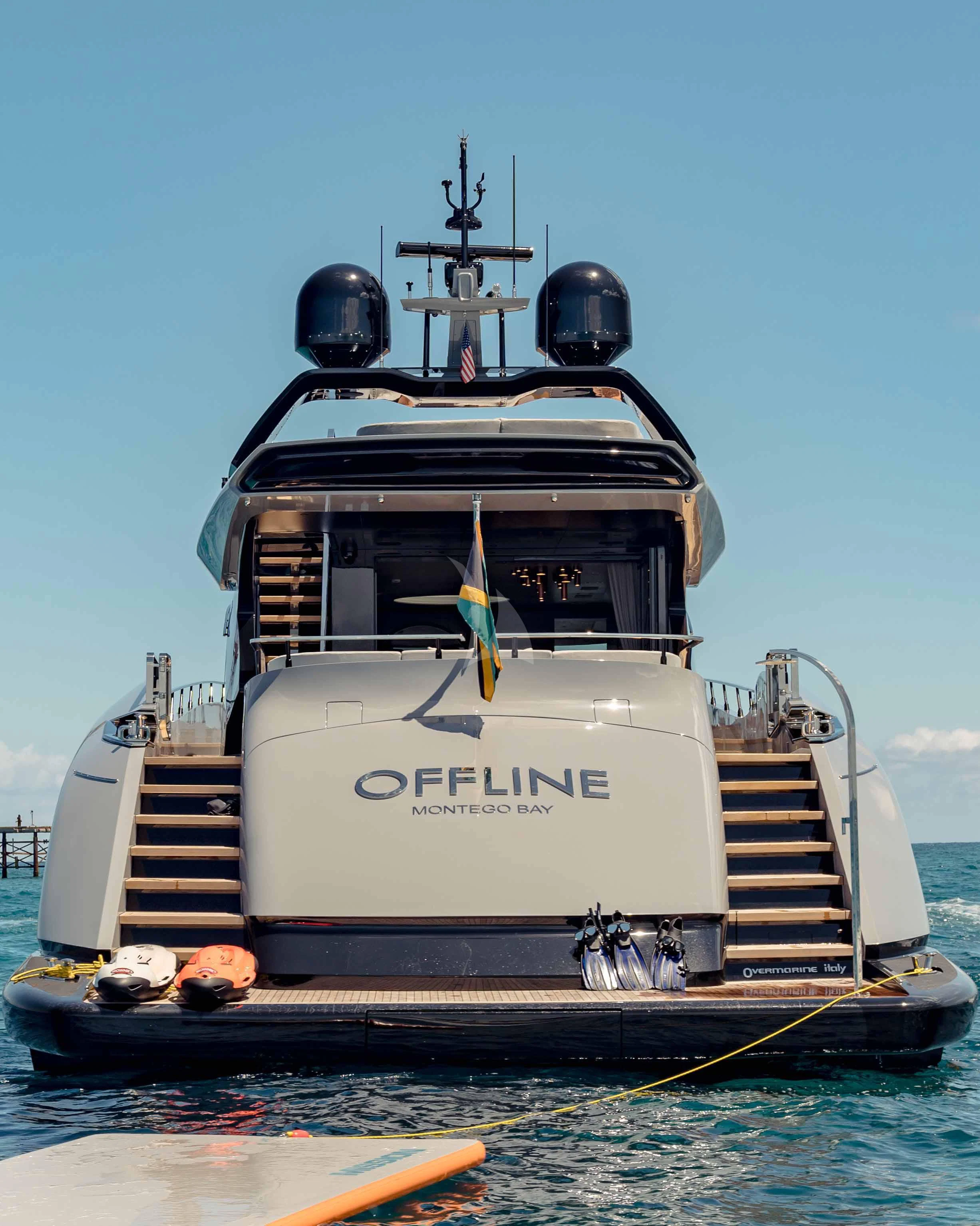 a boat with a staircase attached aboard OFFLINE Yacht for Charter
