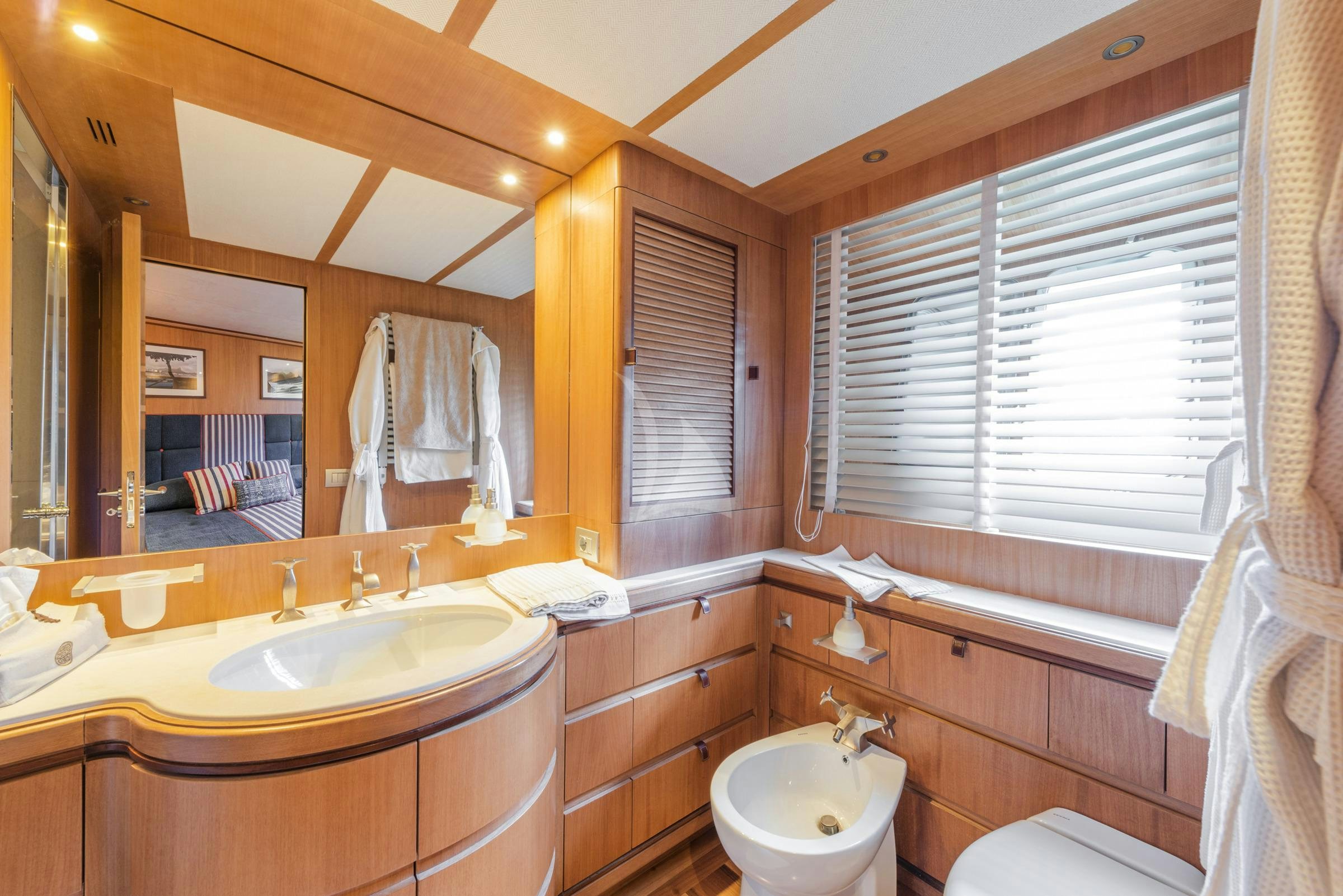 a bathroom with a large mirror aboard ANGRA TOO Yacht for Charter