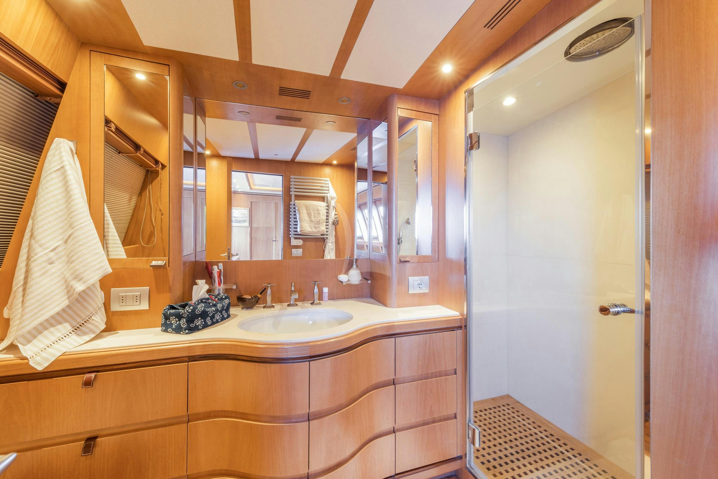 a bathroom with a large mirror aboard ANGRA TOO Yacht for Charter