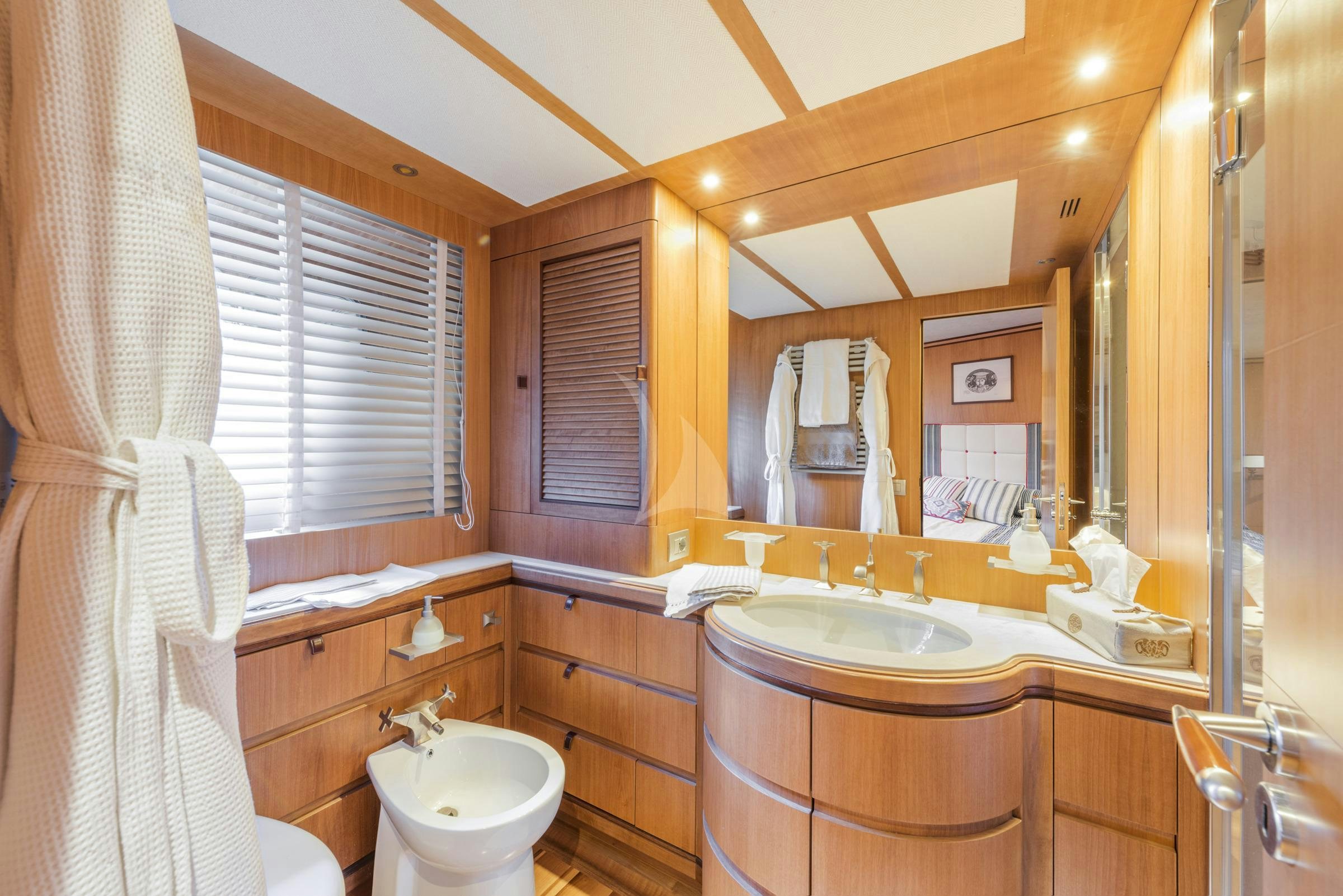 a bathroom with a large mirror aboard ANGRA TOO Yacht for Charter