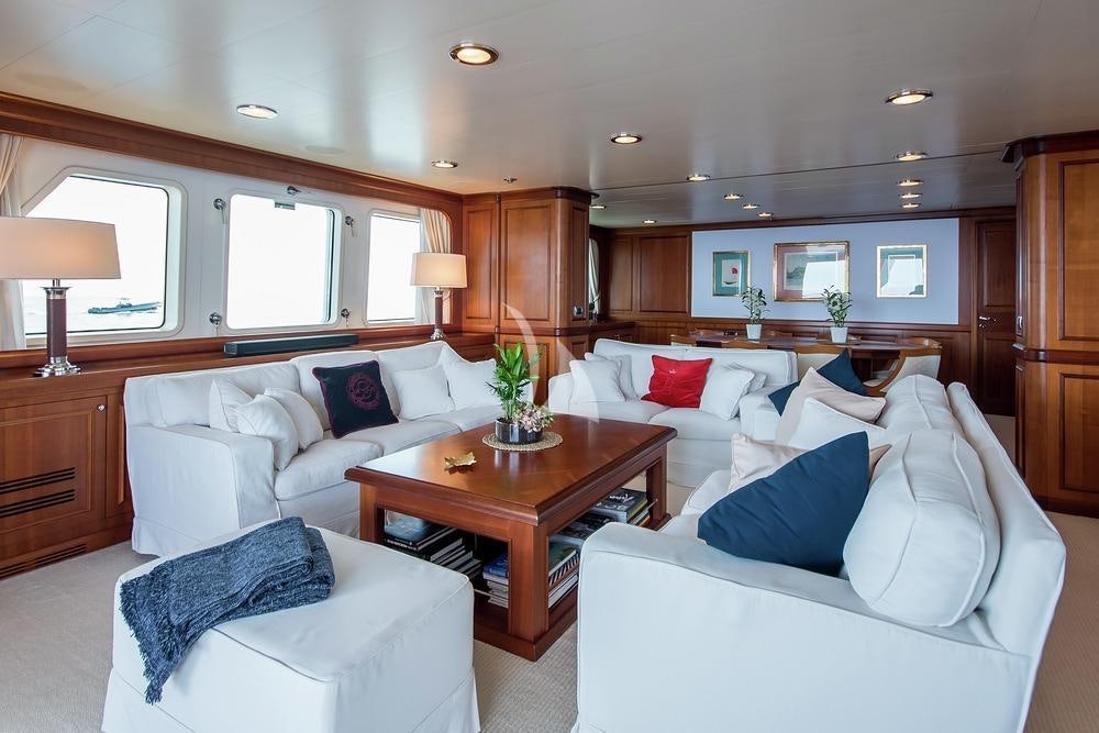 a living room with a couch and a coffee table aboard ELENI Yacht for Charter