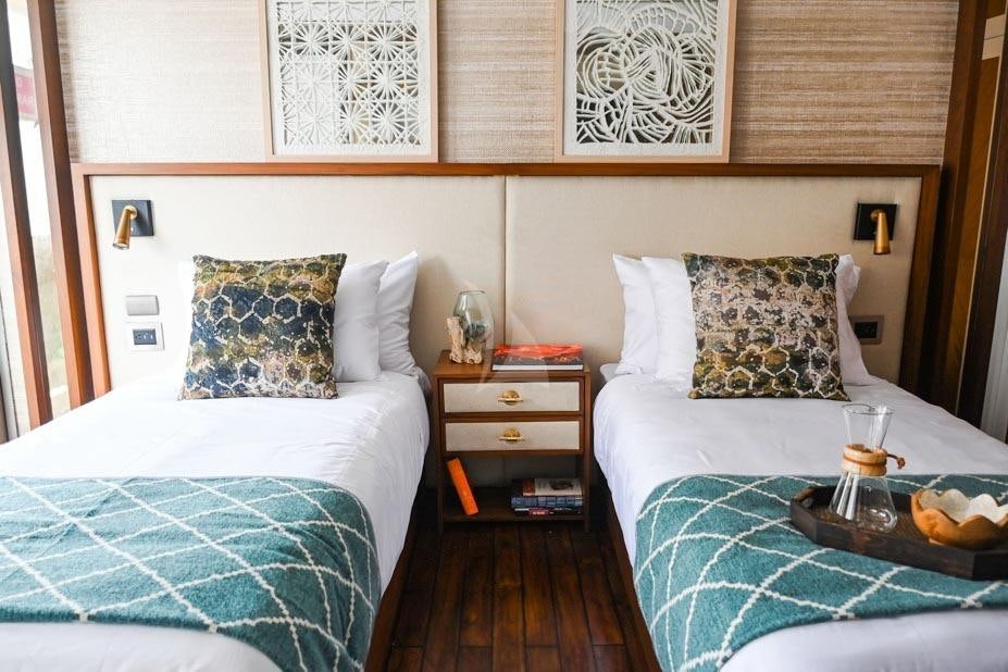 a room with two beds aboard KONTIKI WAYRA Yacht for Charter