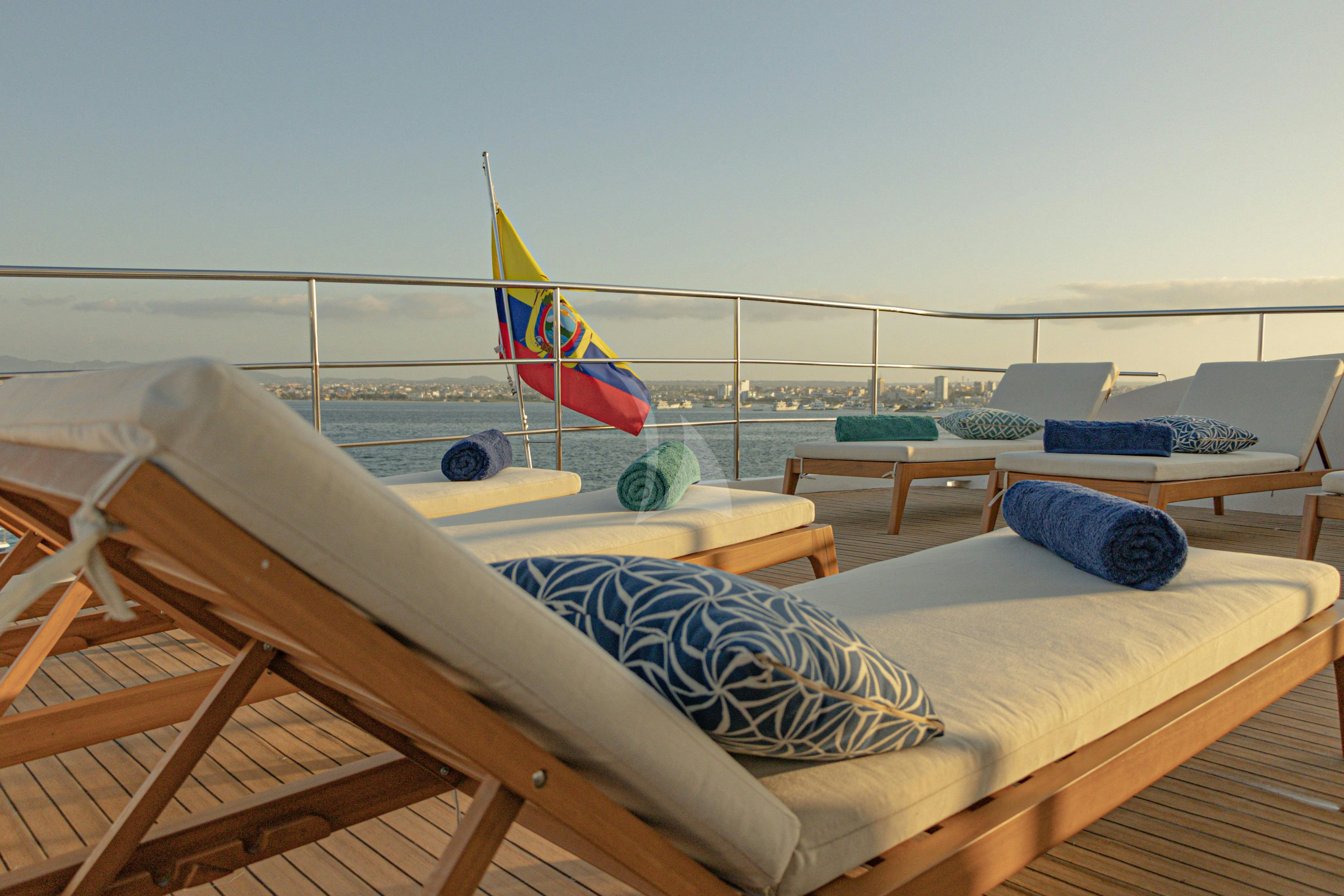 a bed with a flag on it aboard KONTIKI WAYRA Yacht for Charter