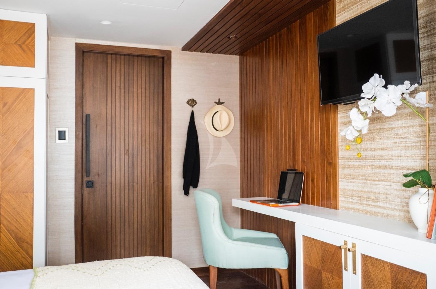 a room with a desk and a laptop aboard KONTIKI WAYRA Yacht for Charter