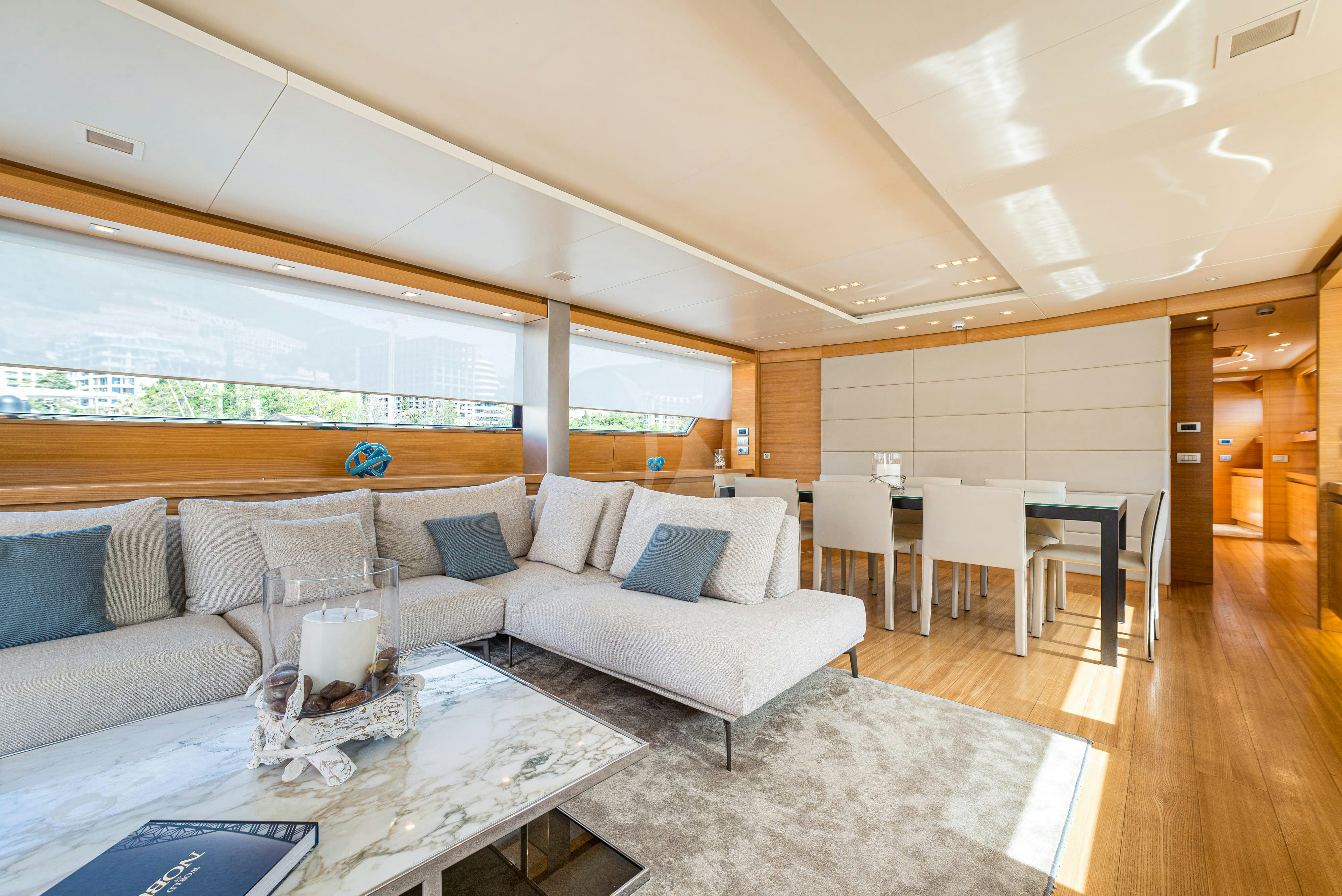a living room with a couch and a table aboard PERTULA Yacht for Charter