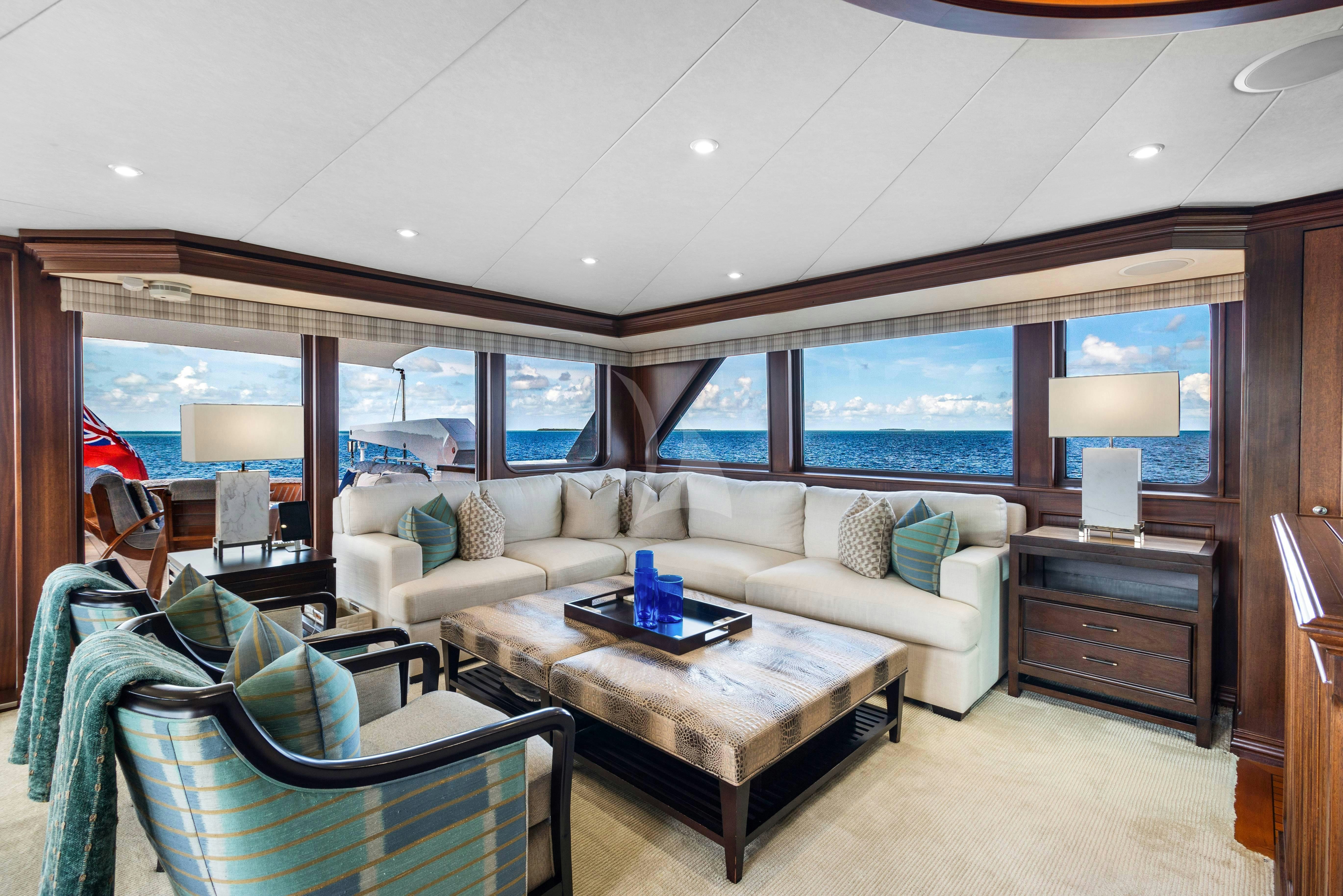 a living room with a couch and a table aboard GITANA Yacht for Charter