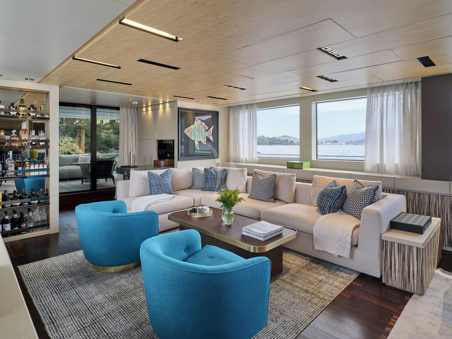 a living room with a couch and a table aboard RARE DIAMOND Yacht for Charter