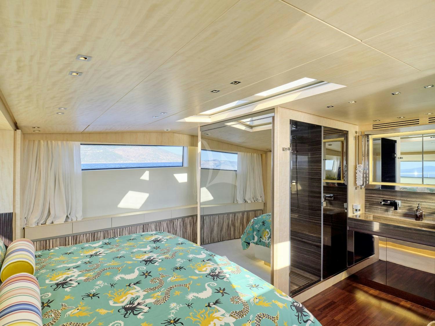 a large bathroom with a large jacuzzi aboard RARE DIAMOND Yacht for Charter
