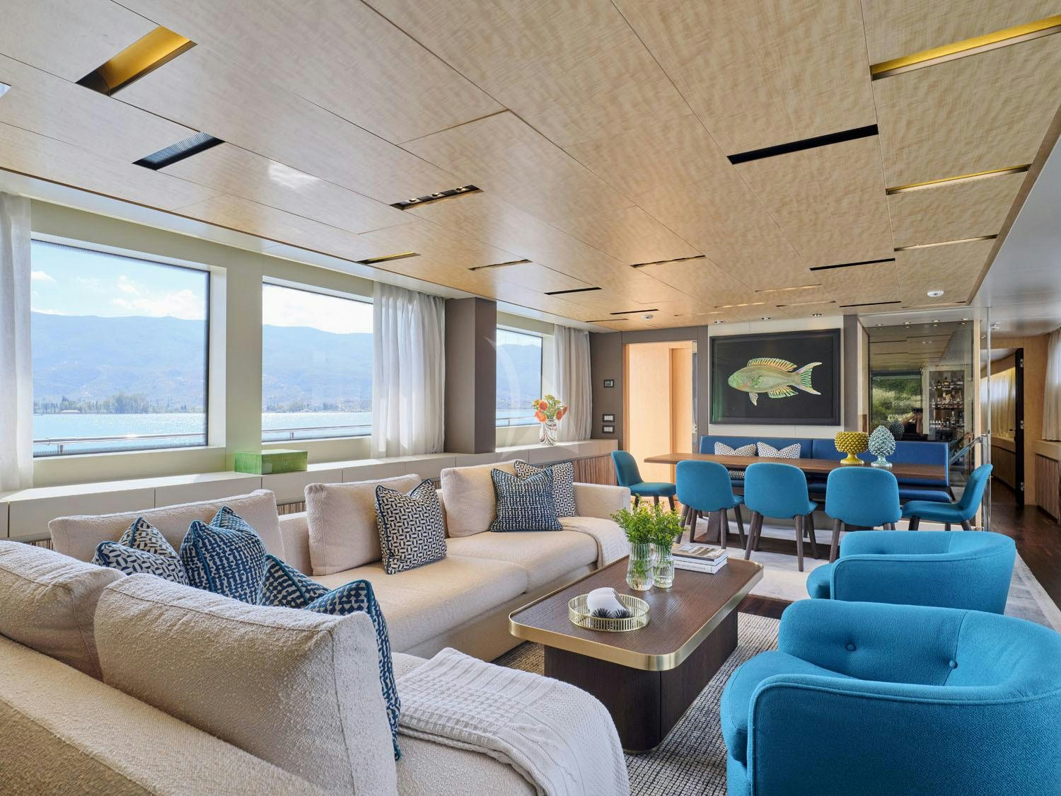 a living room with a couch and a table aboard RARE DIAMOND Yacht for Charter