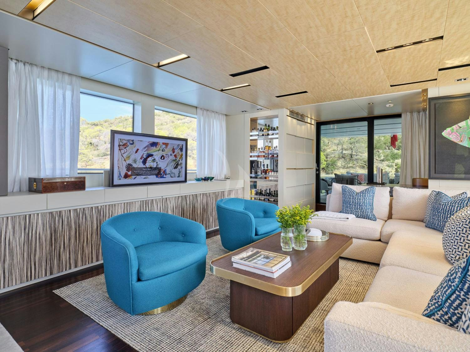 a living room with a couch and a coffee table aboard RARE DIAMOND Yacht for Charter