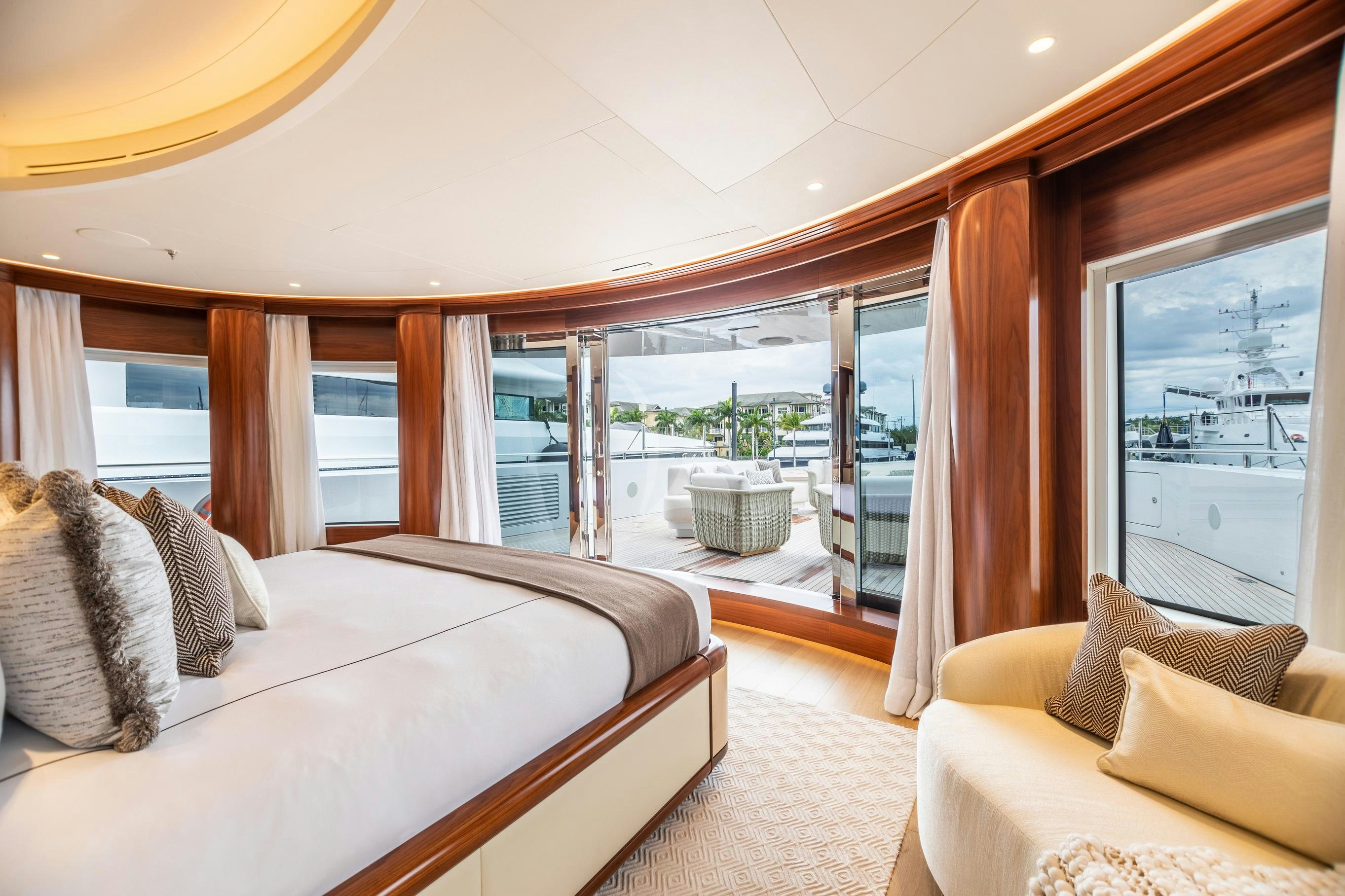 a bedroom with a large bed aboard CALEX Yacht for Charter