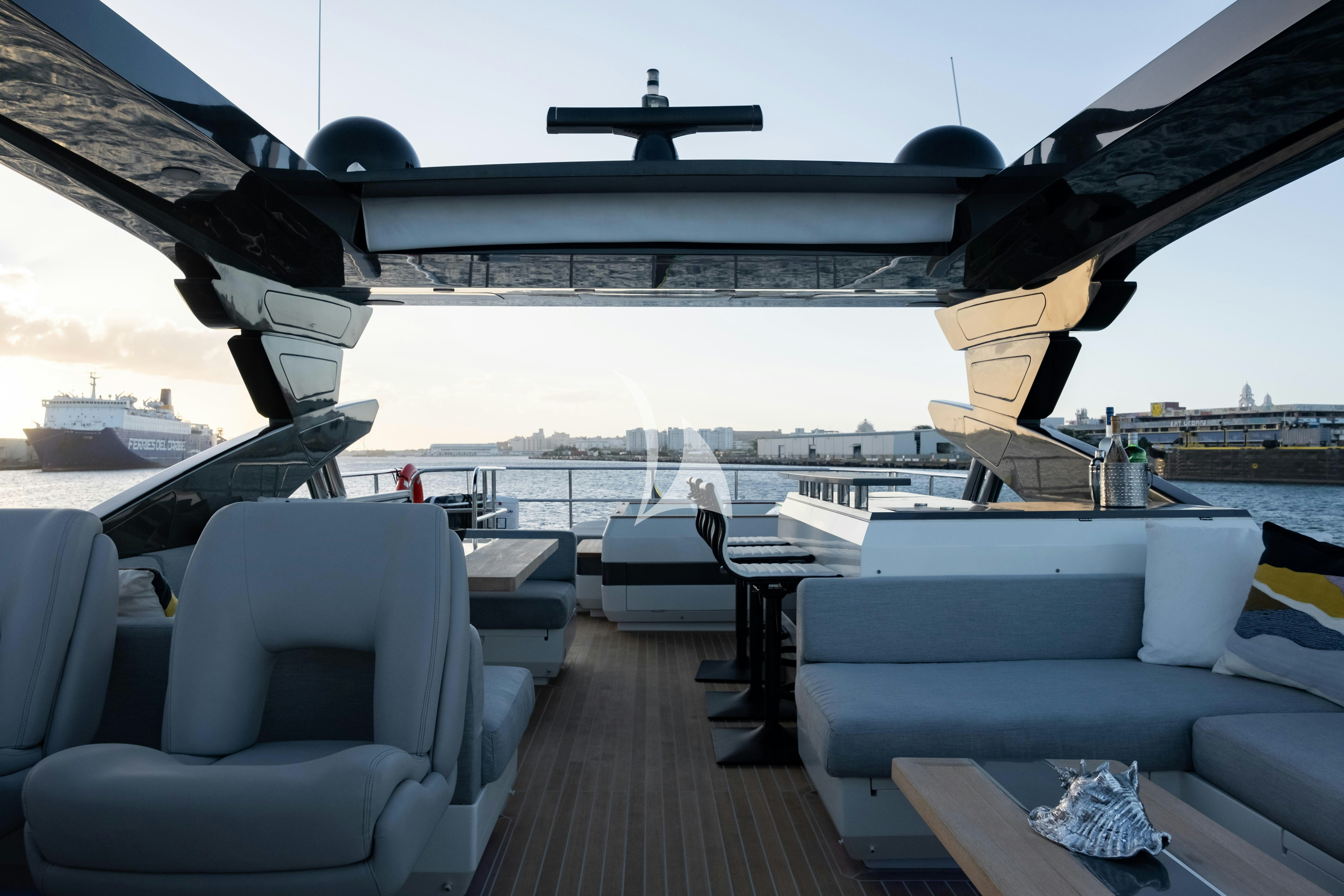 a deck with chairs and a plane on it aboard OMNIA Yacht for Charter