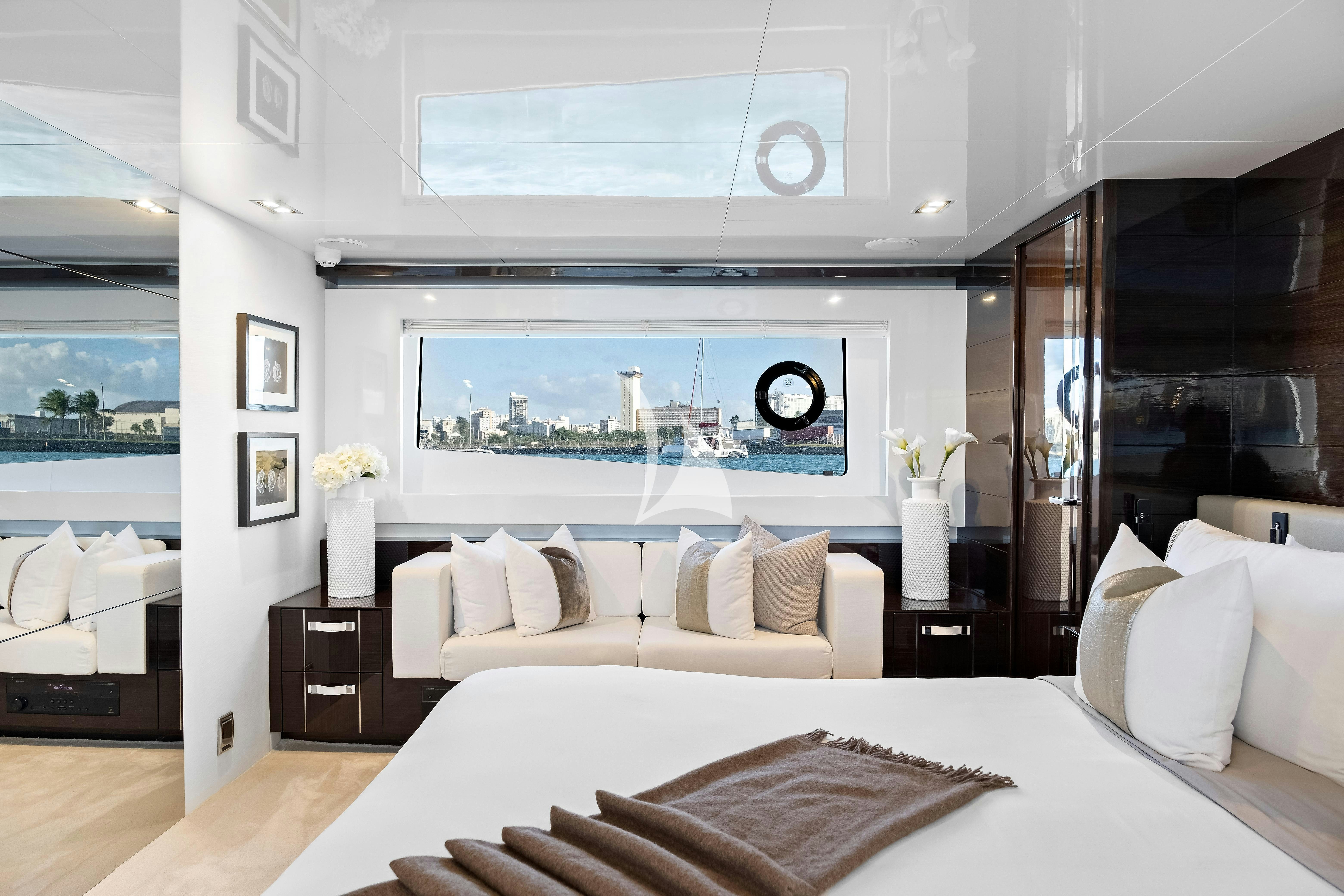 a large bed in a room aboard OMNIA Yacht for Charter