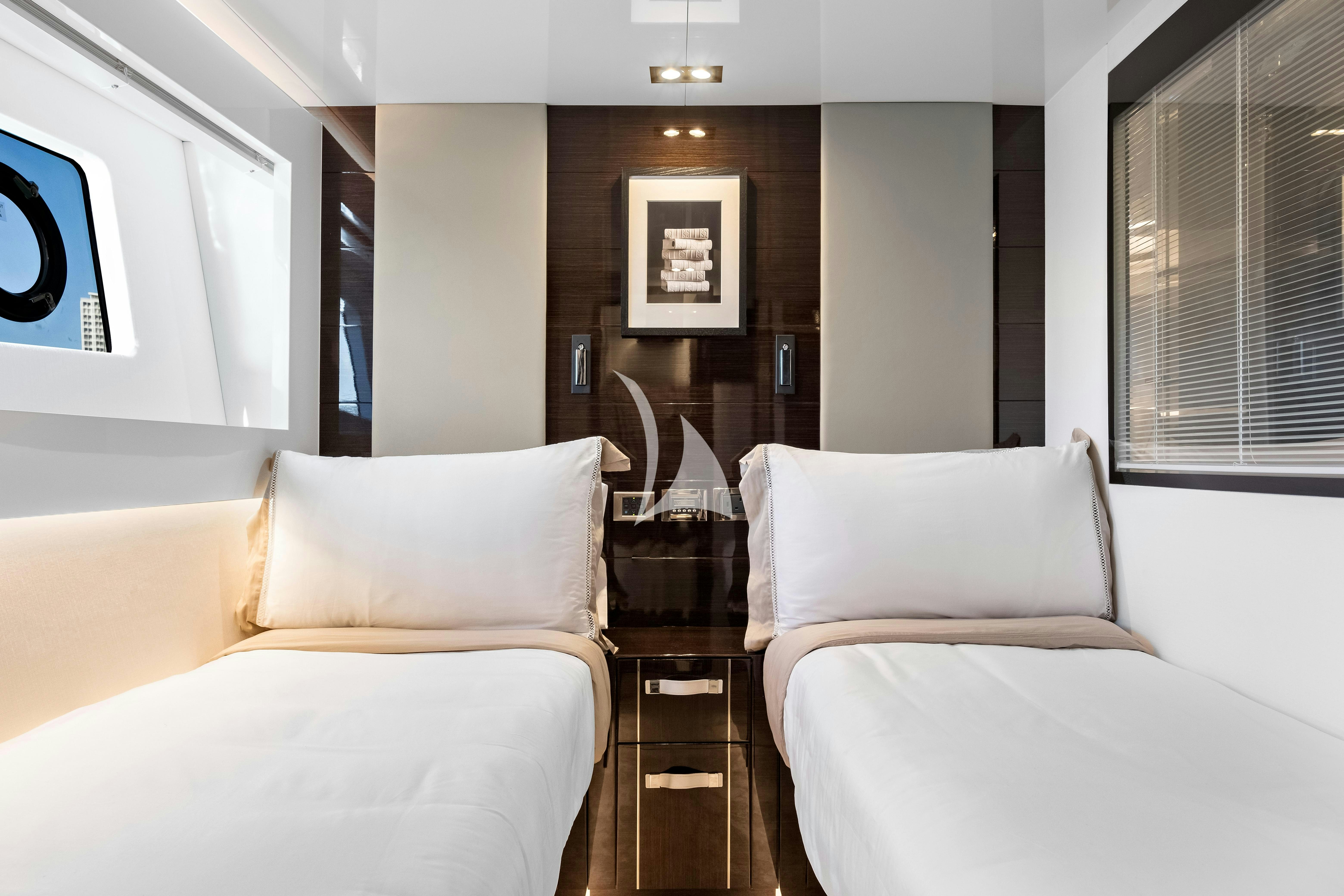 a room with white couches aboard OMNIA Yacht for Charter