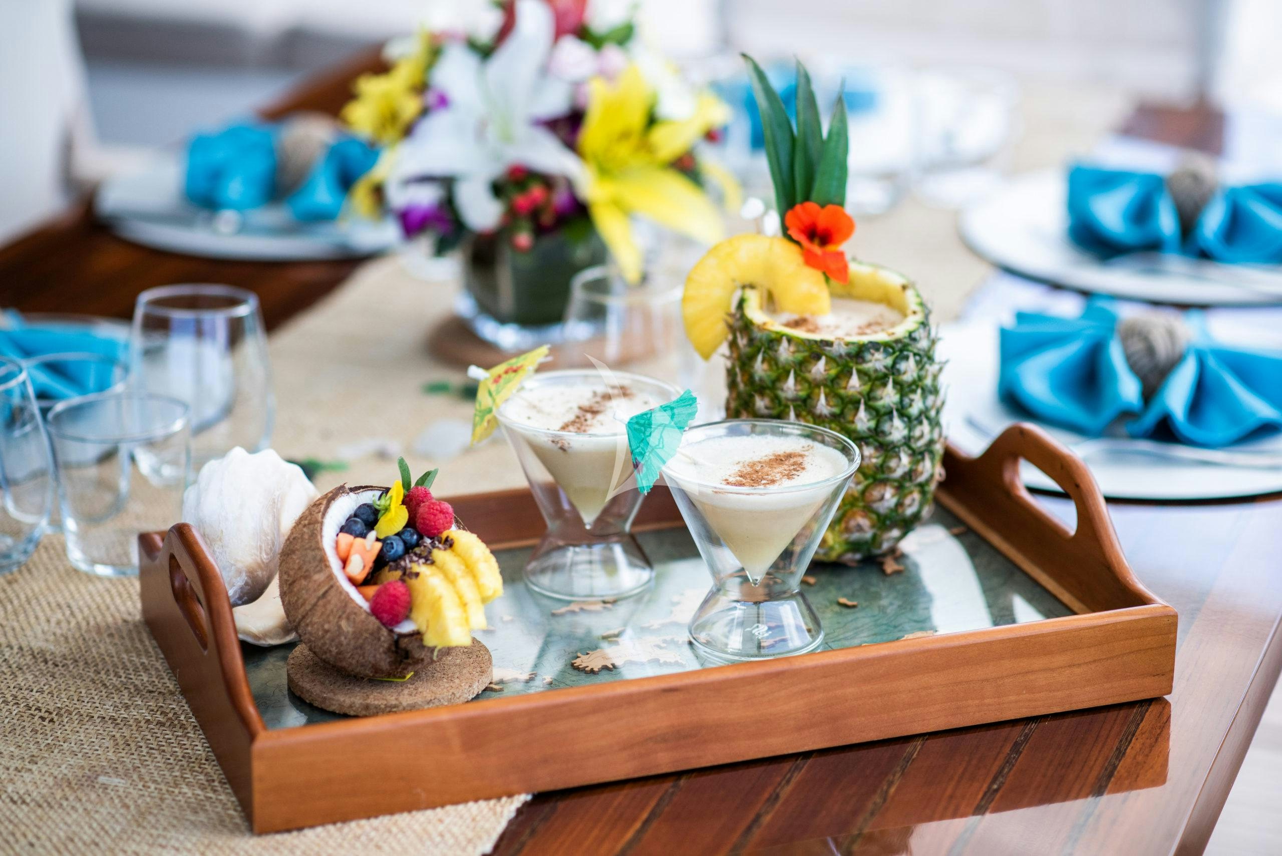 a table with food and glasses aboard BUNDALONG Yacht for Charter
