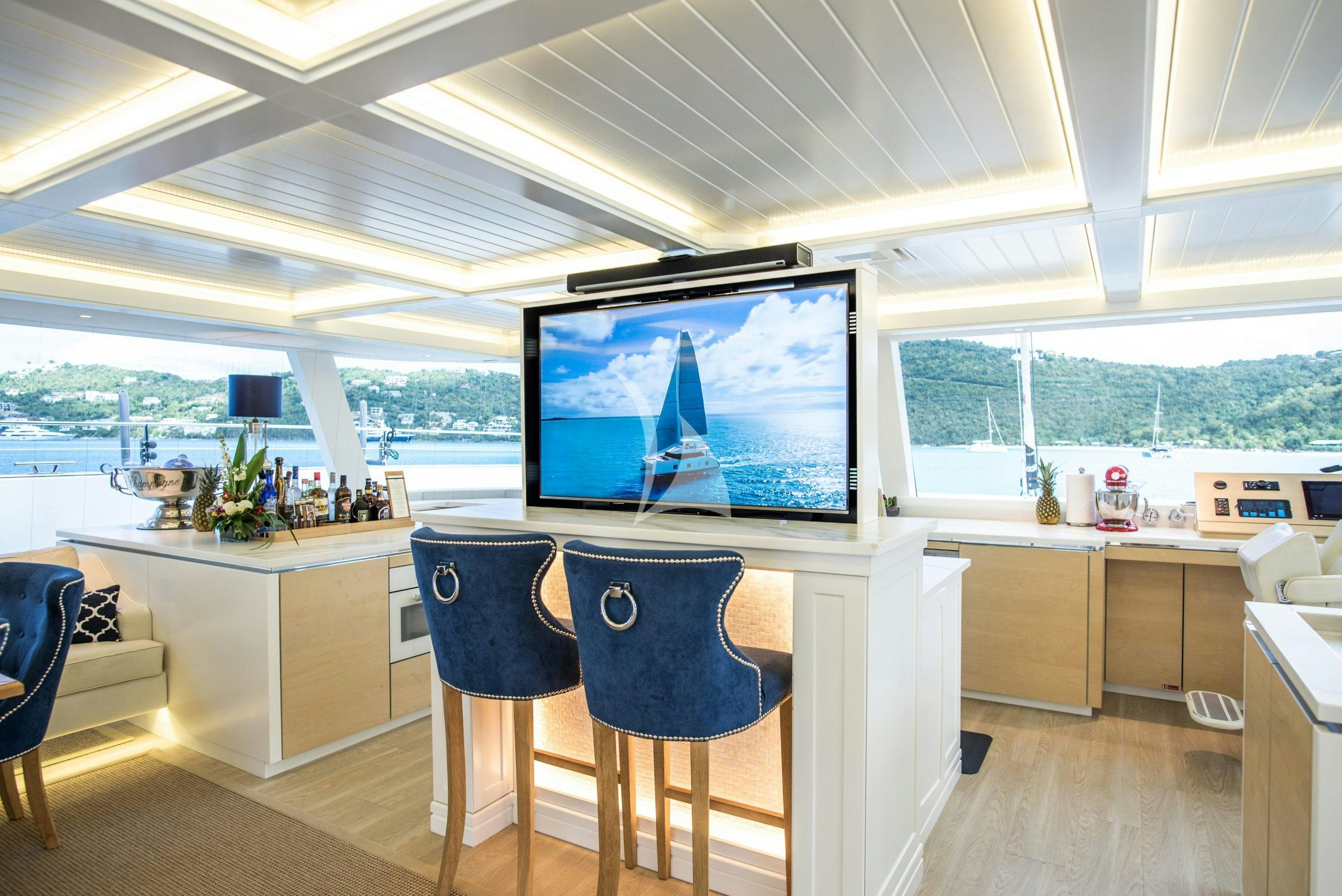 a room with a large tv aboard BUNDALONG Yacht for Charter