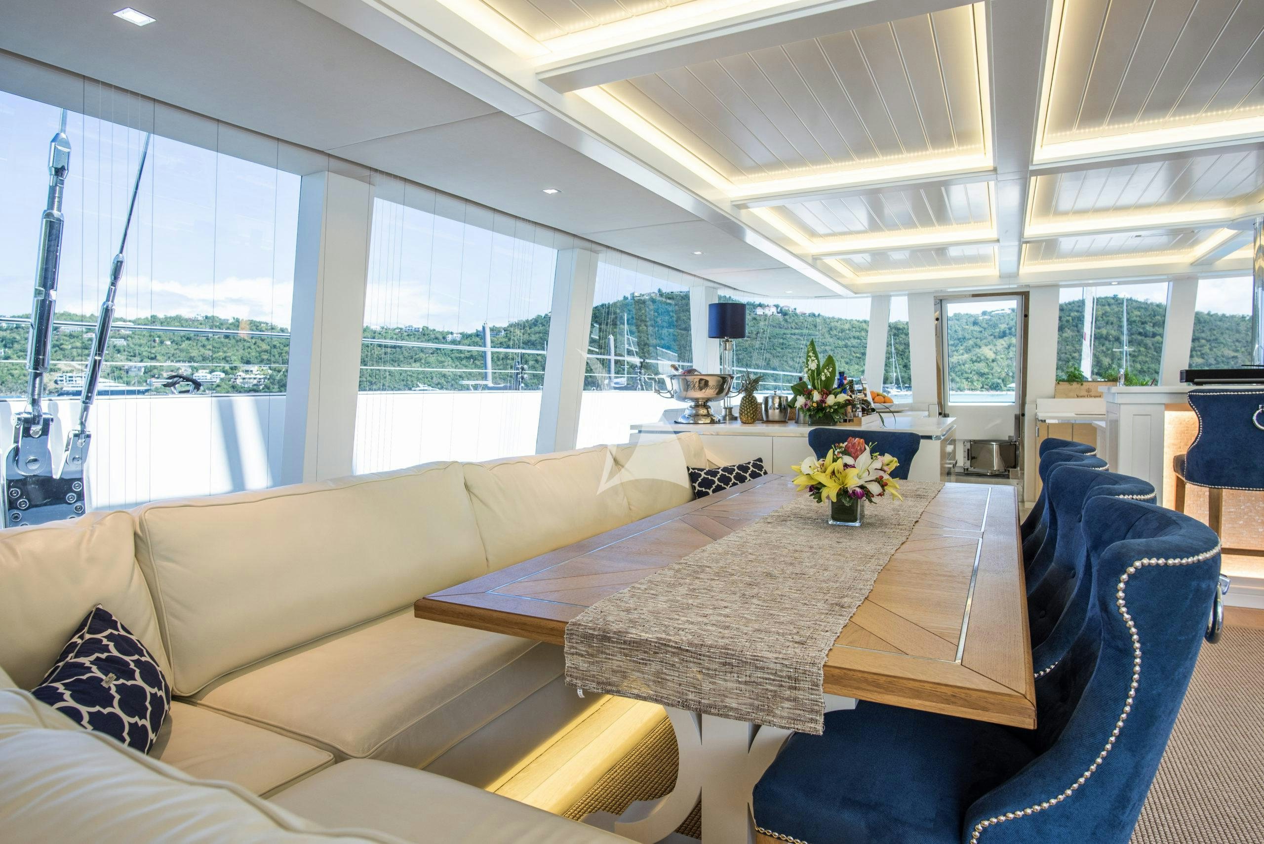 a room with a table and chairs aboard BUNDALONG Yacht for Charter