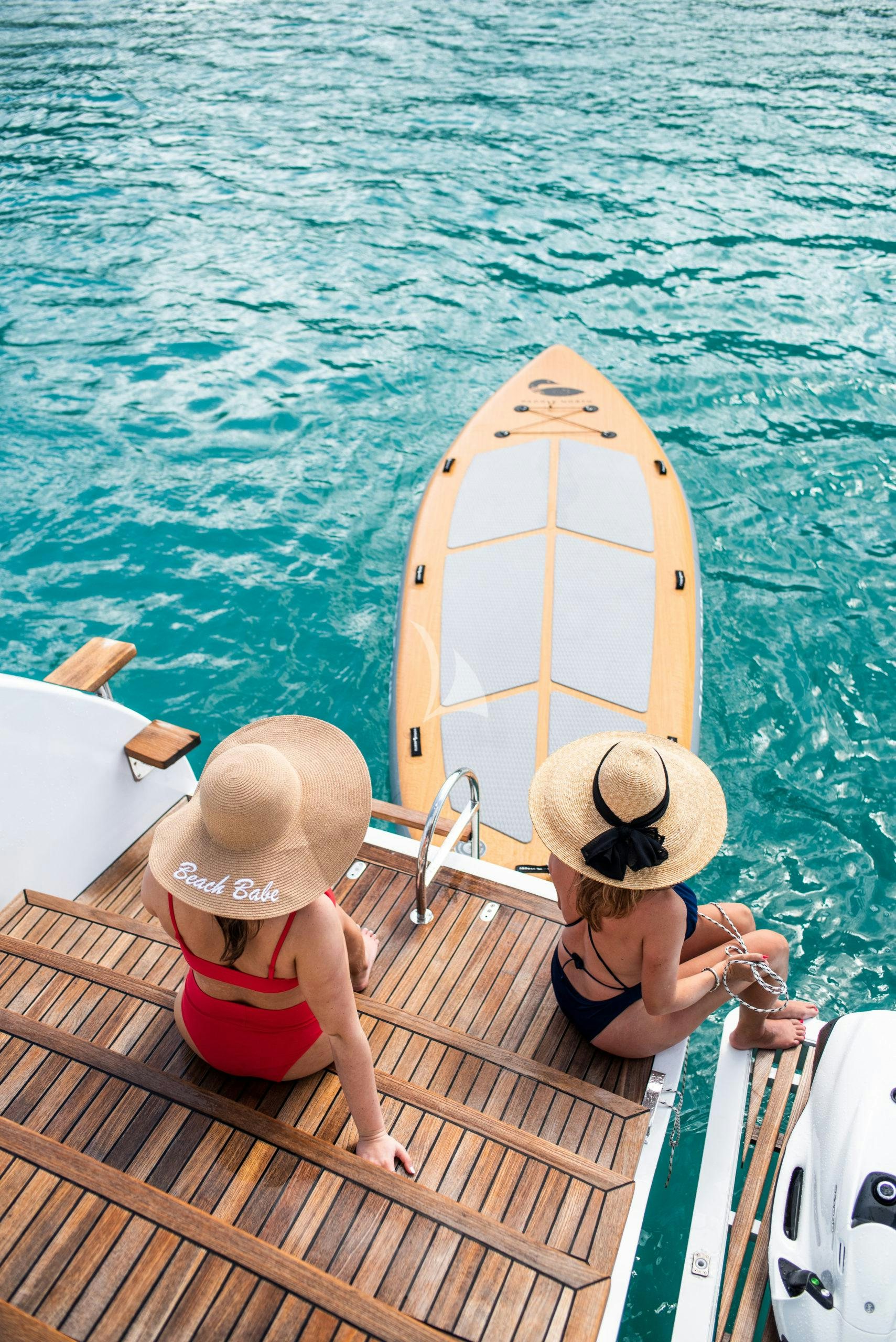 a couple of people on a boat aboard BUNDALONG Yacht for Charter