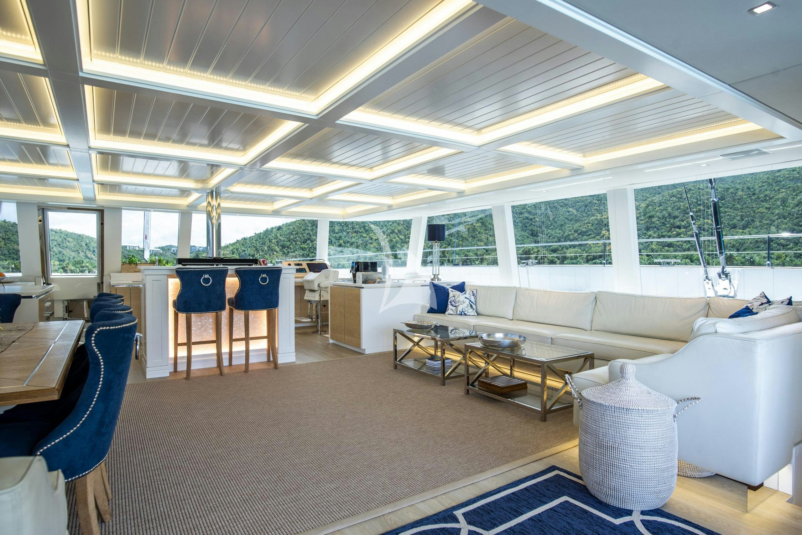 a room with a couch and a table aboard BUNDALONG Yacht for Charter