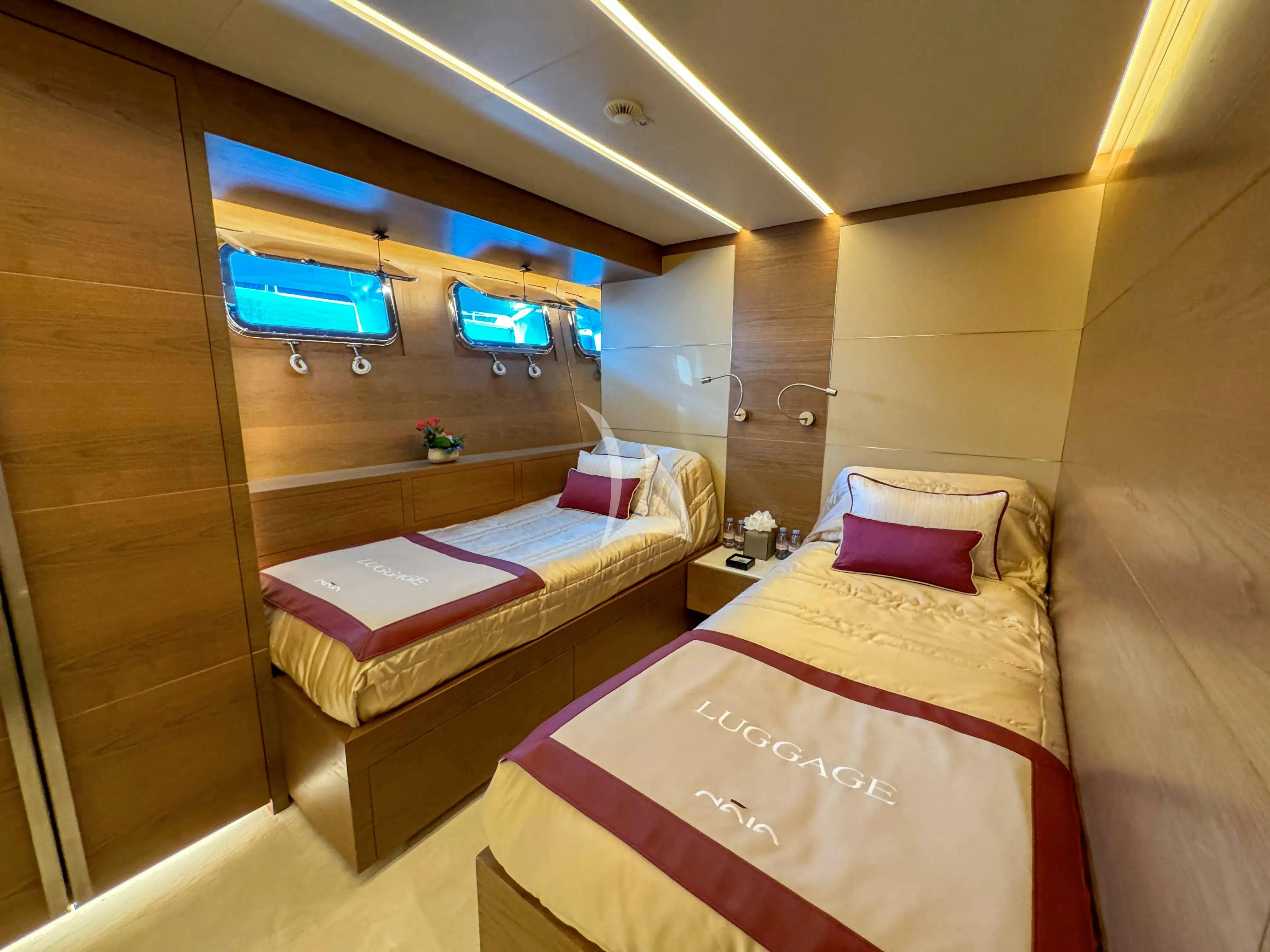a room with a bed and a mirror aboard NAIA Yacht for Charter