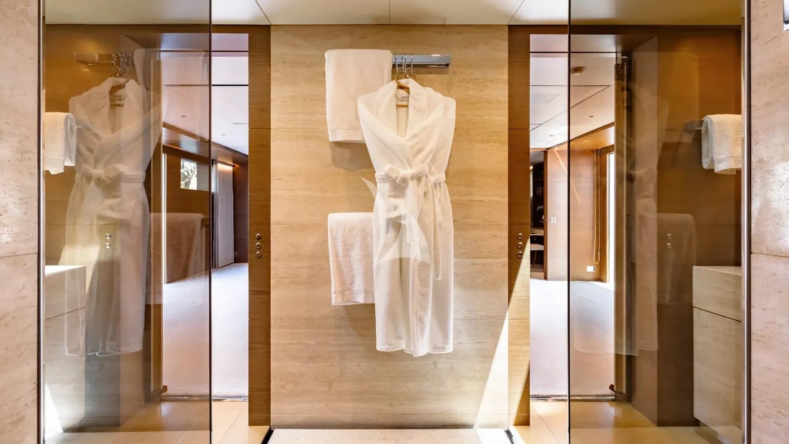 a white dress on a swinger aboard NAIA Yacht for Charter