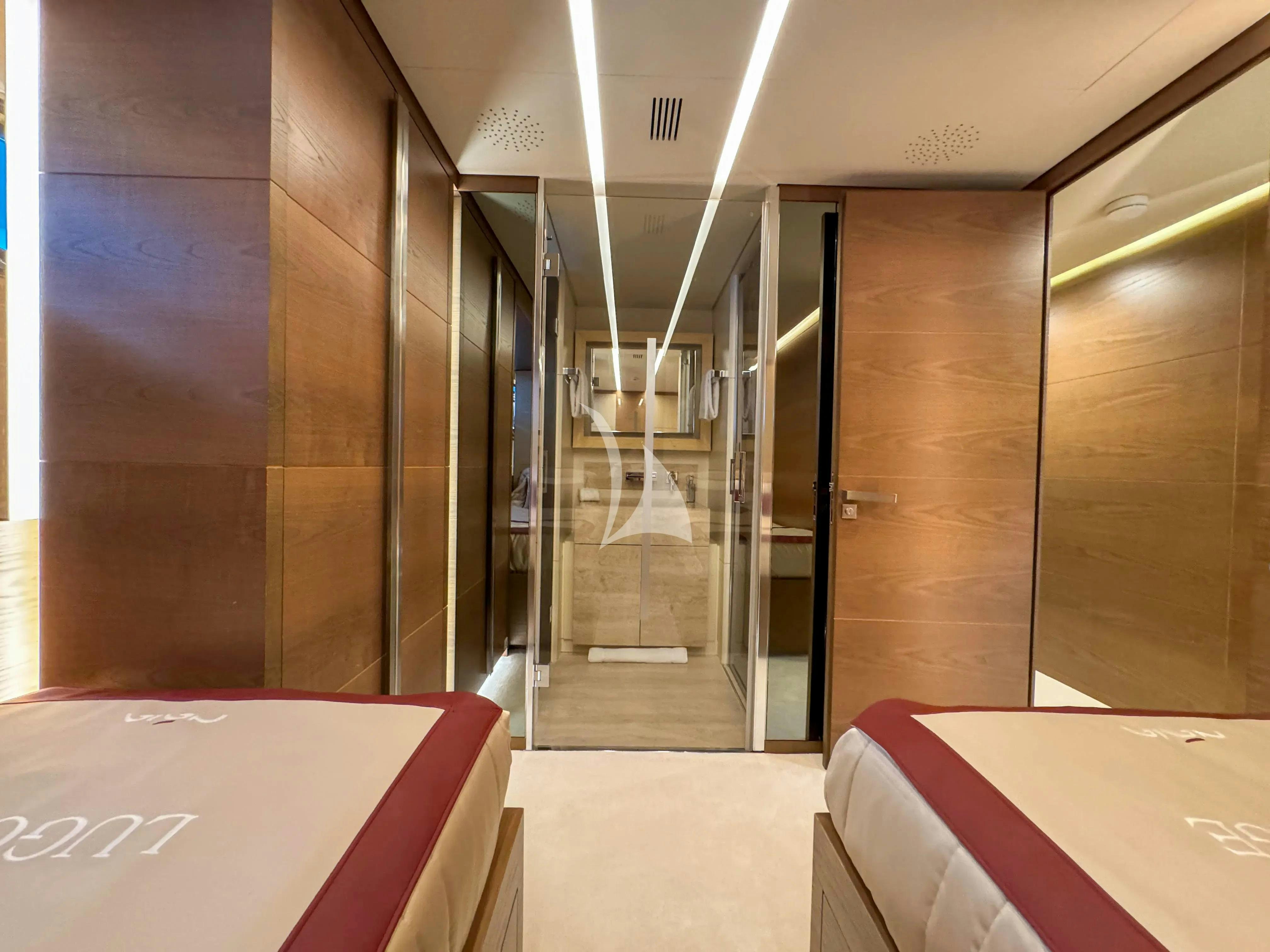 a room with a glass wall aboard NAIA Yacht for Charter