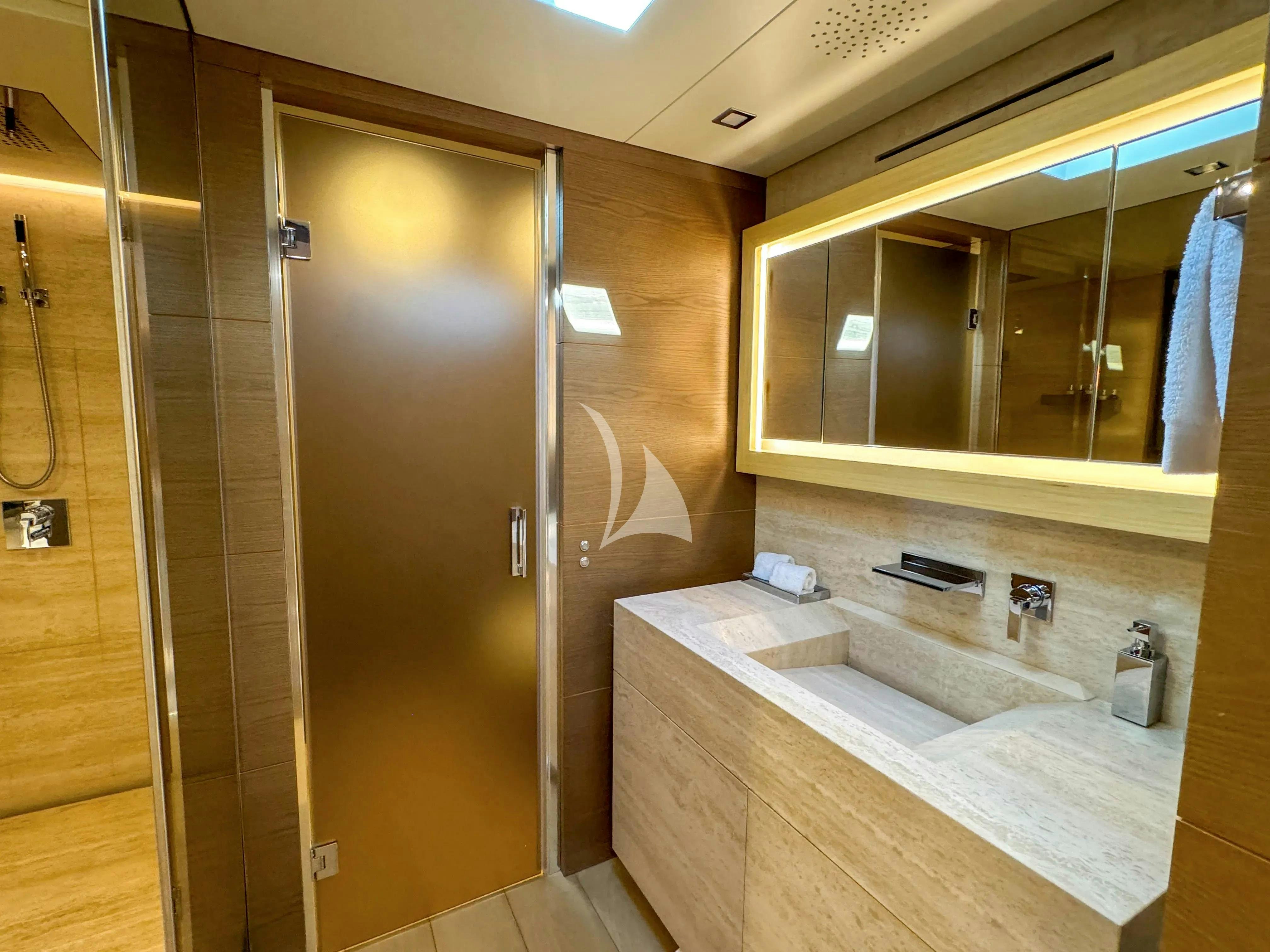 a bathroom with a large shower unit aboard NAIA Yacht for Charter