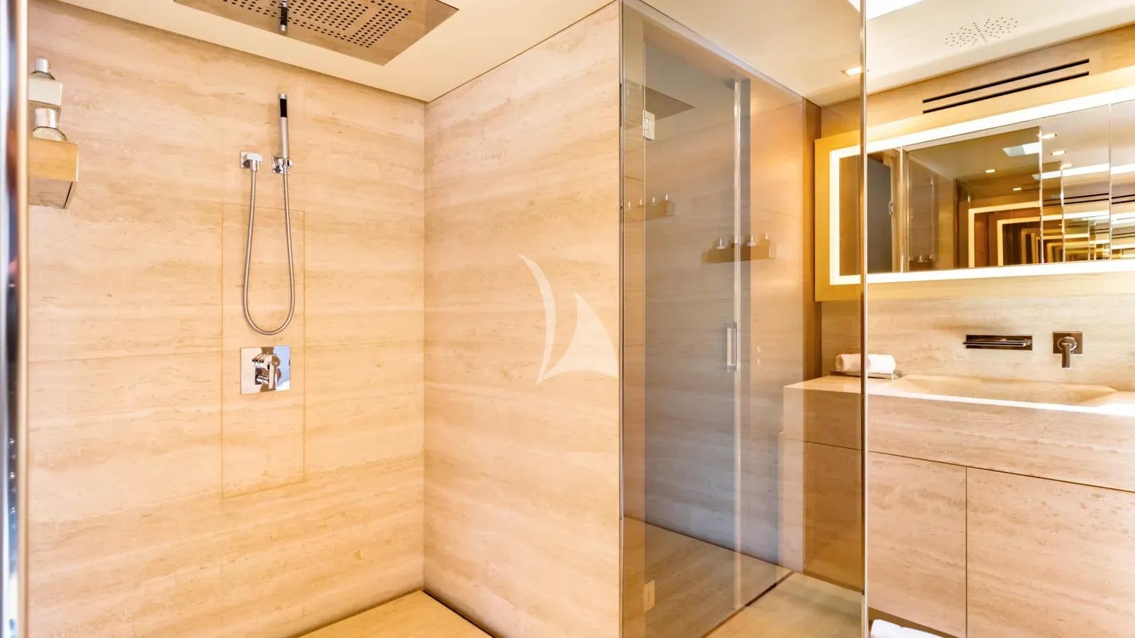 a room with wooden cabinets aboard NAIA Yacht for Charter